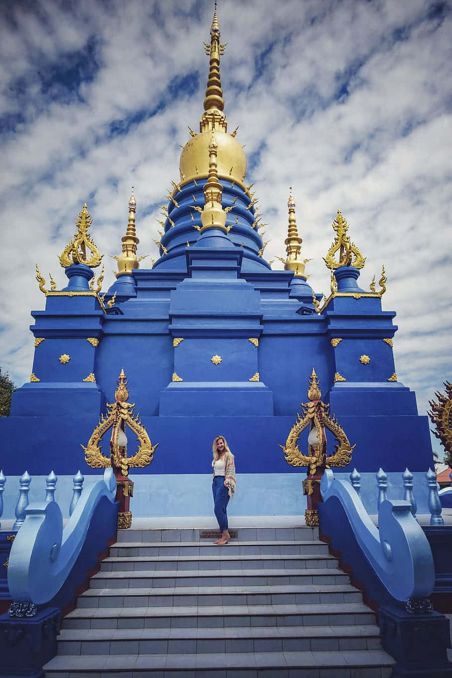 Woman In Front Of The Blue Temple In Chiang Rai Wallpaper