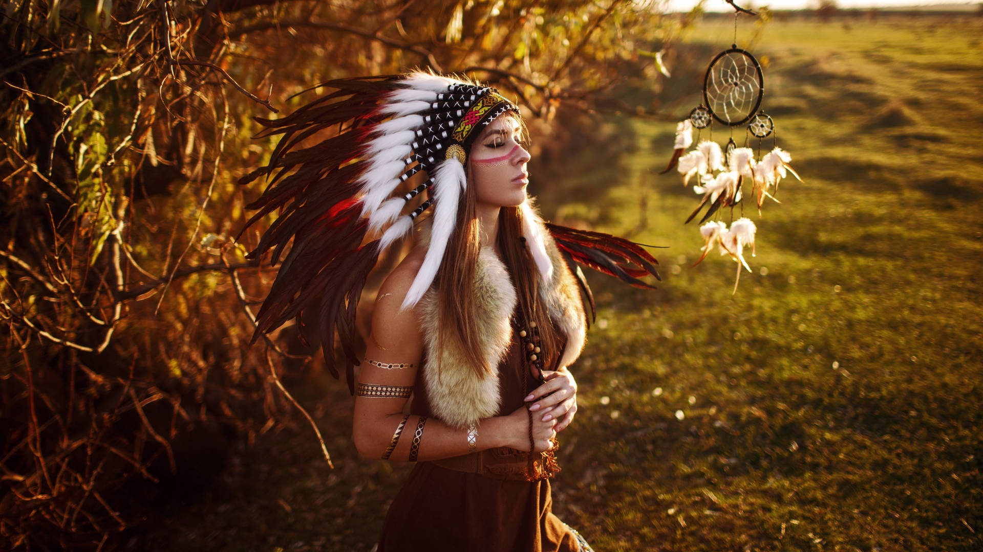 Woman In Indigenous Feathered Costume Wallpaper