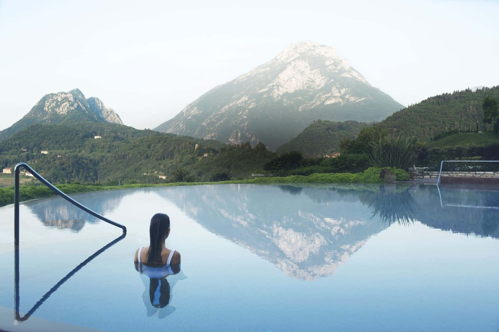 Woman In Pool At Lago Di Garda Wallpaper