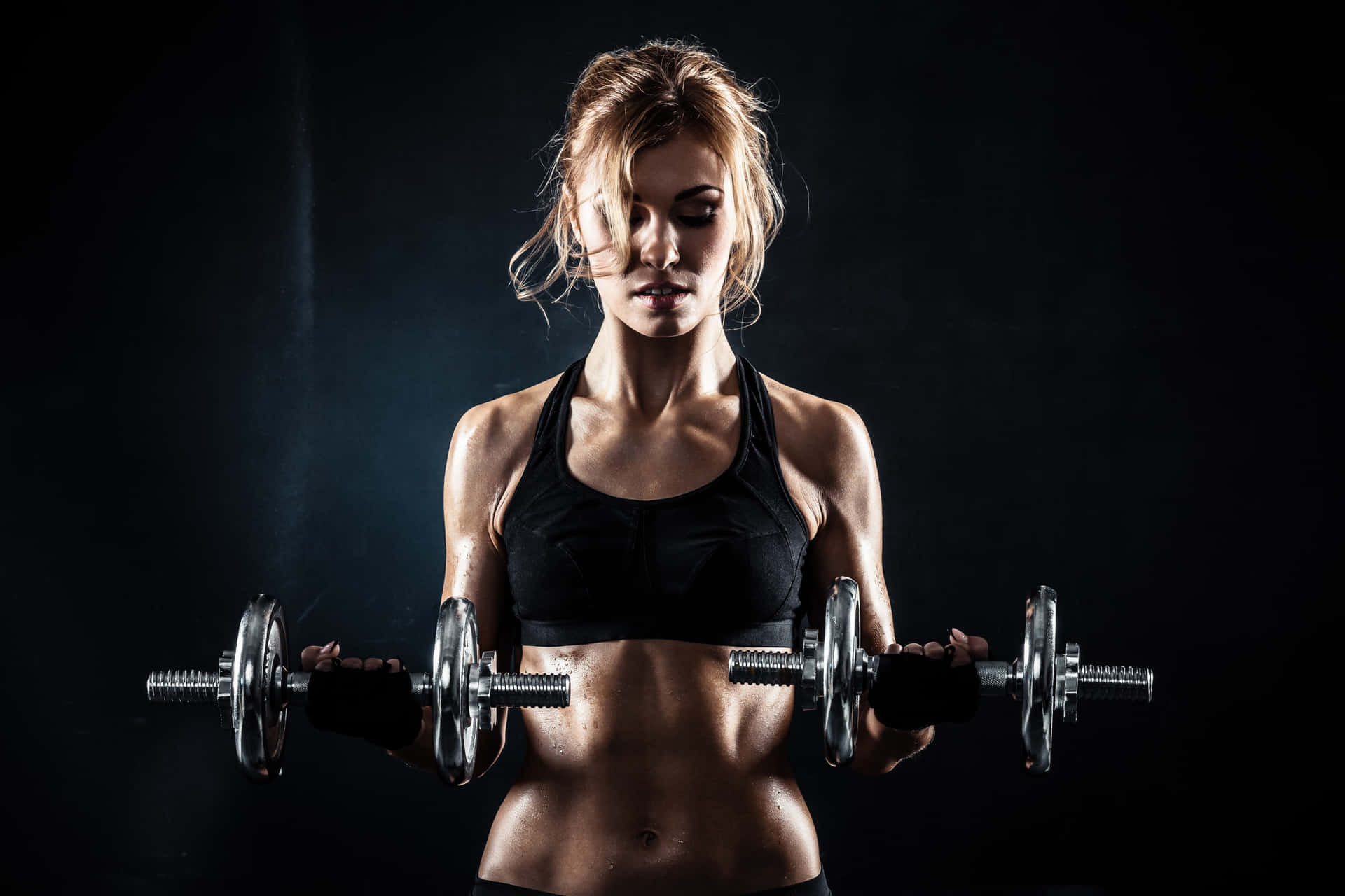 Woman In Sexy Pose With Weights Wallpaper