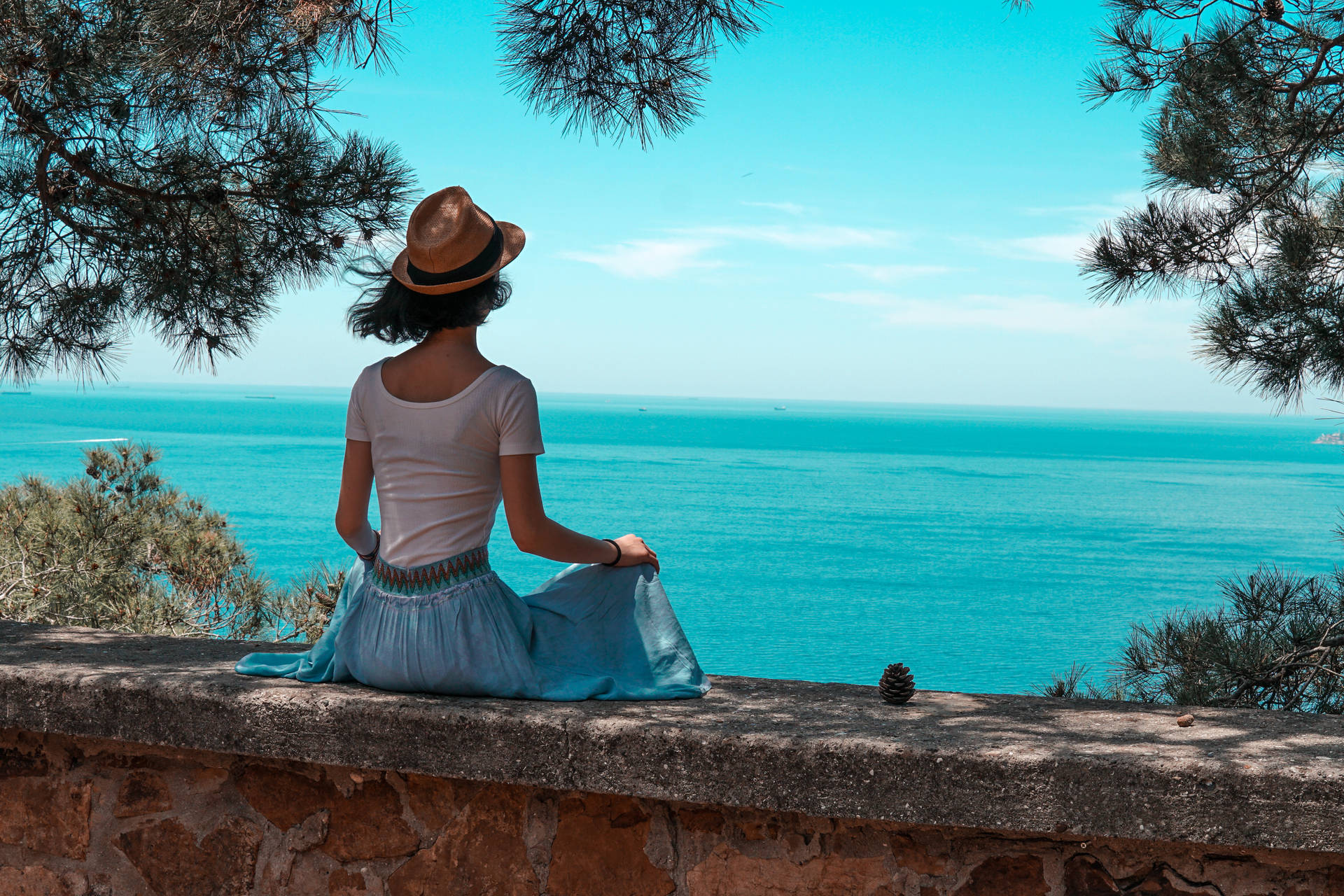 Woman Looking At Beautiful Blue Sea Wallpaper