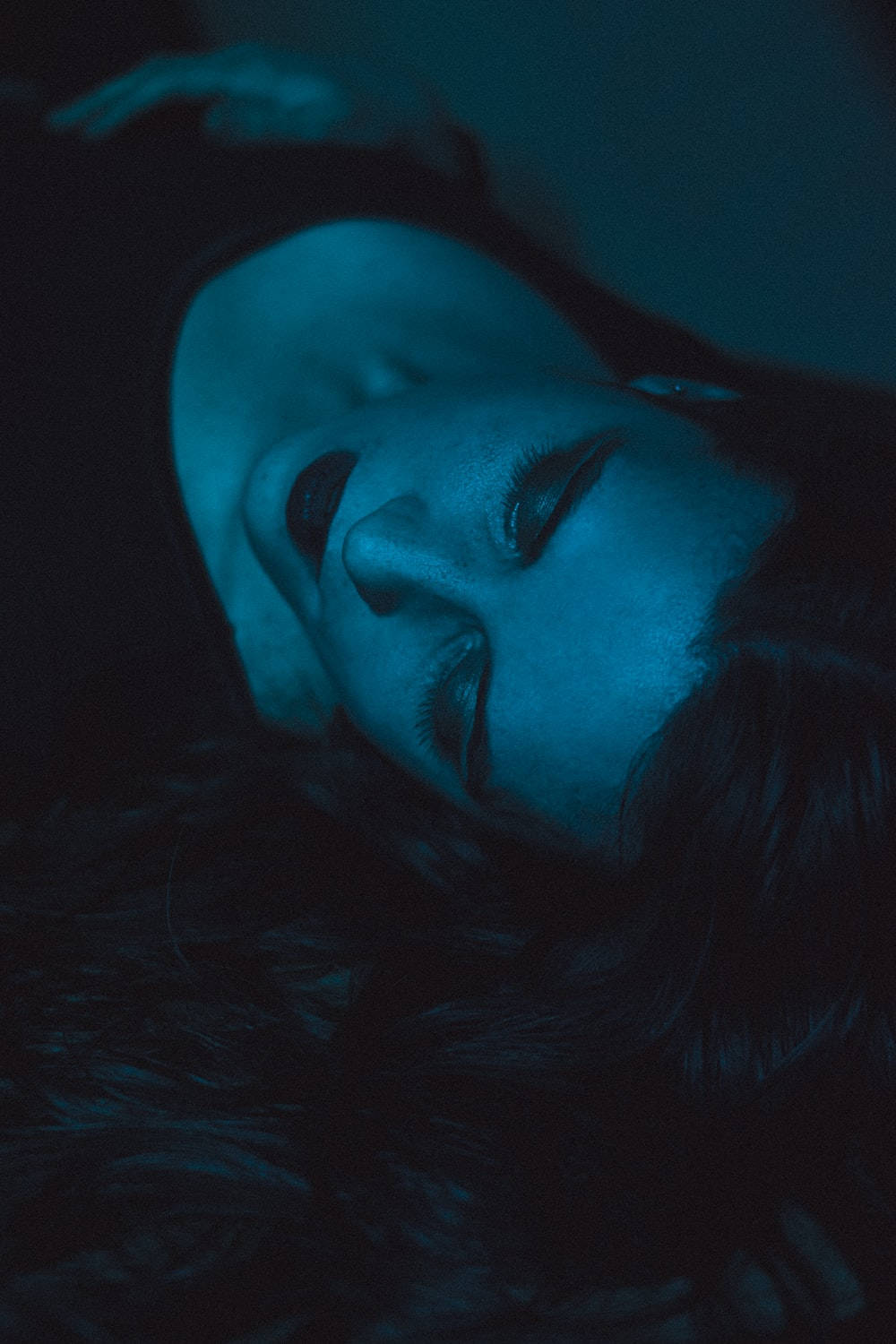 Woman Lying With Dark Lips Wallpaper