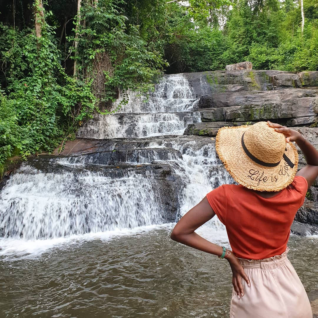 Woman Near The Ivory Coast Waterfall