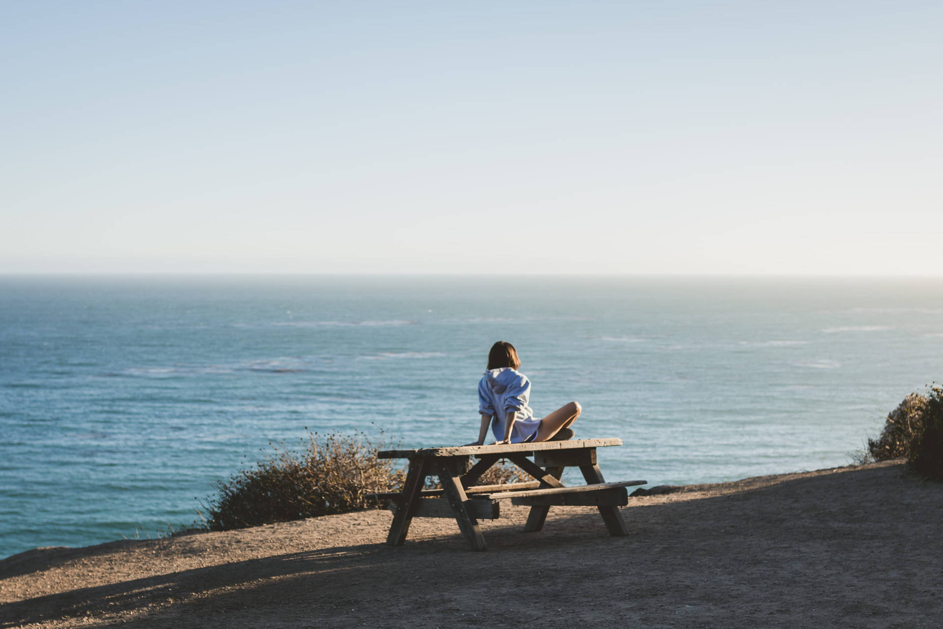 Woman On Malibu Beach Picnic Table Picture