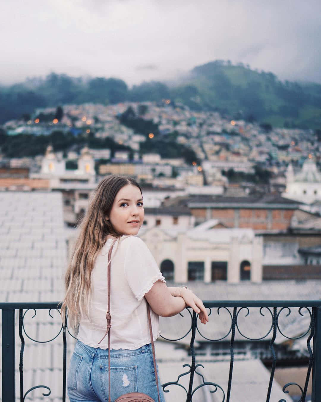 Woman Overlooking Cityscape Wallpaper