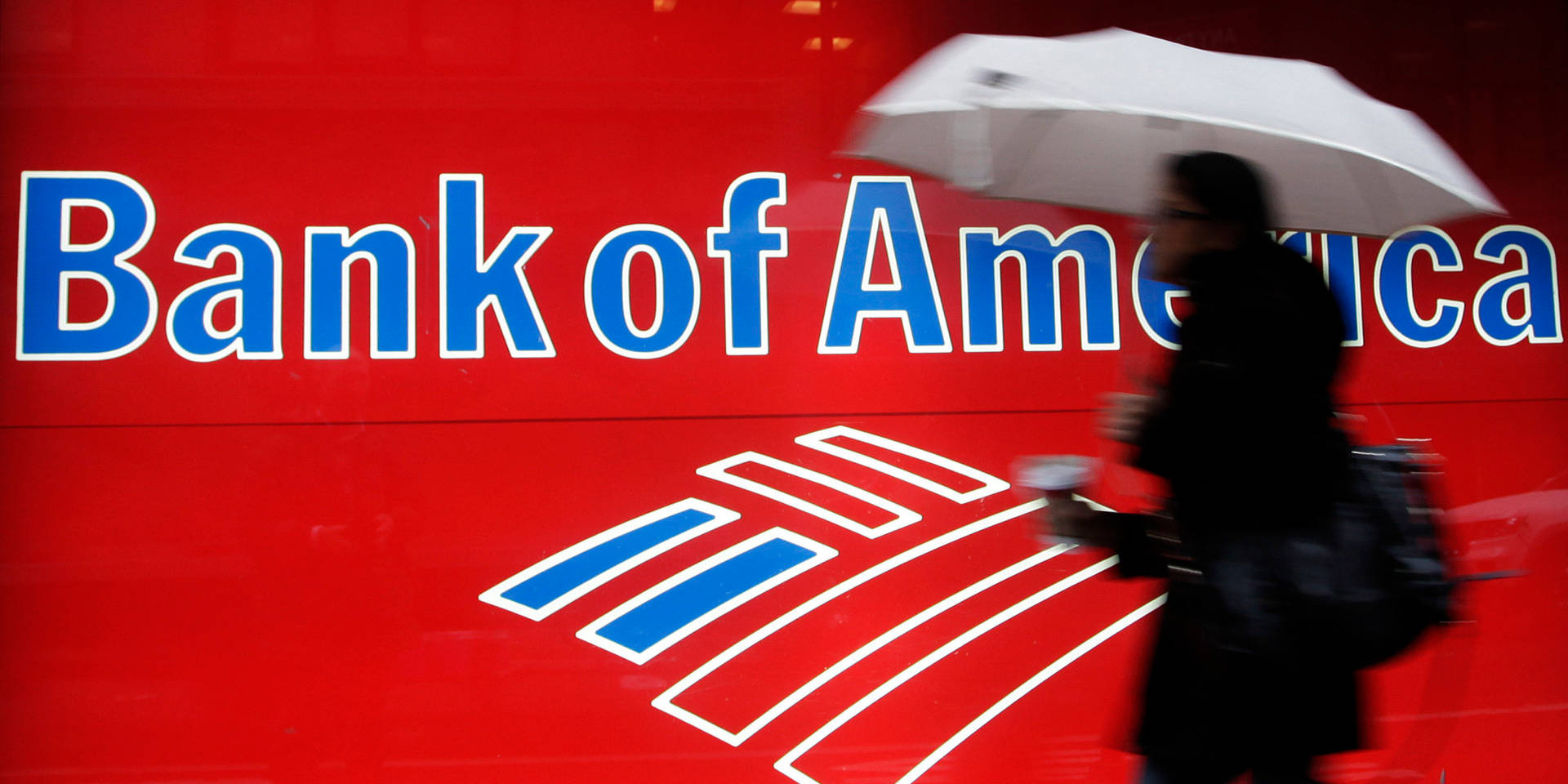 Woman Passing Bank Of America Signage Background