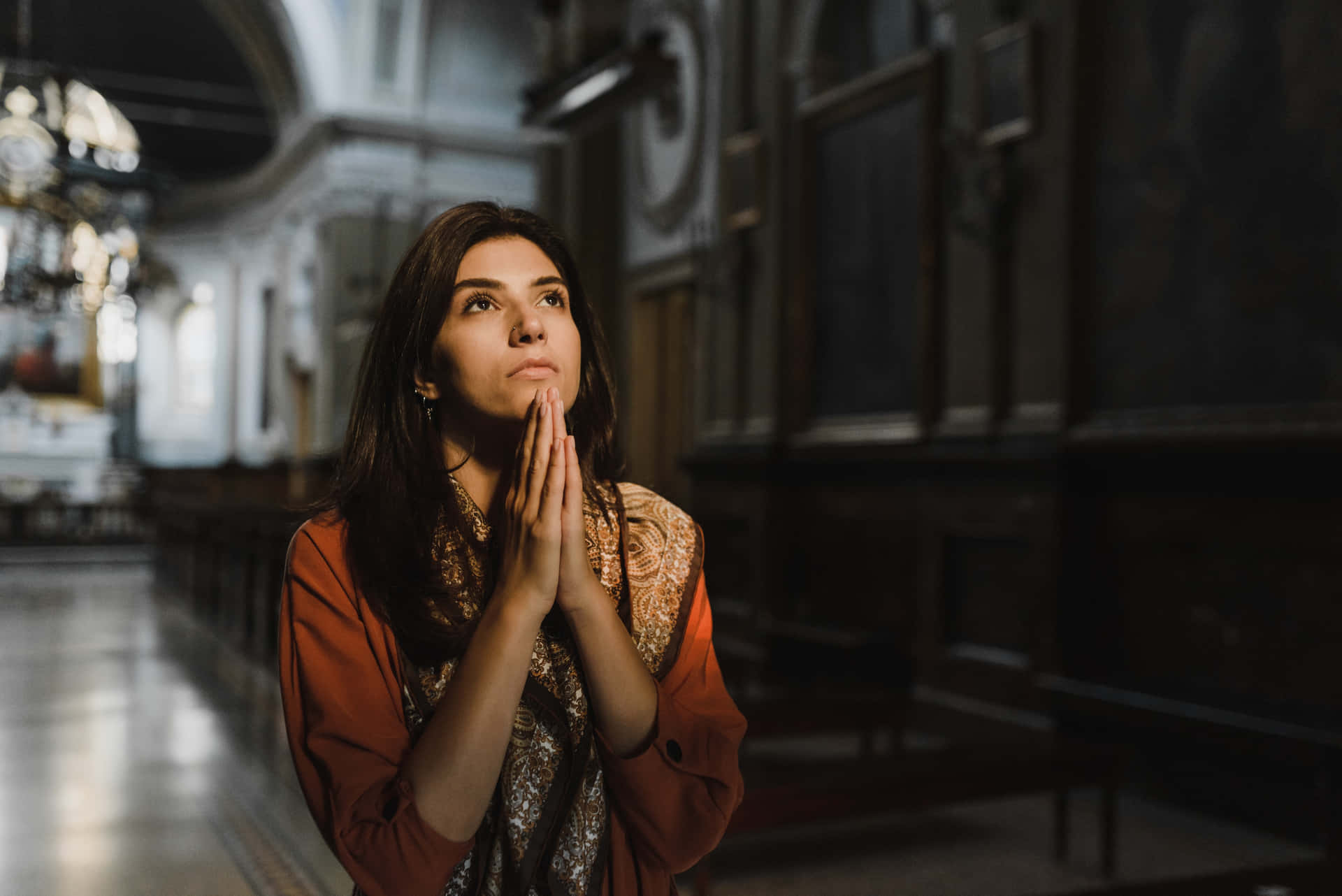 Woman Praying At The Church Wallpaper