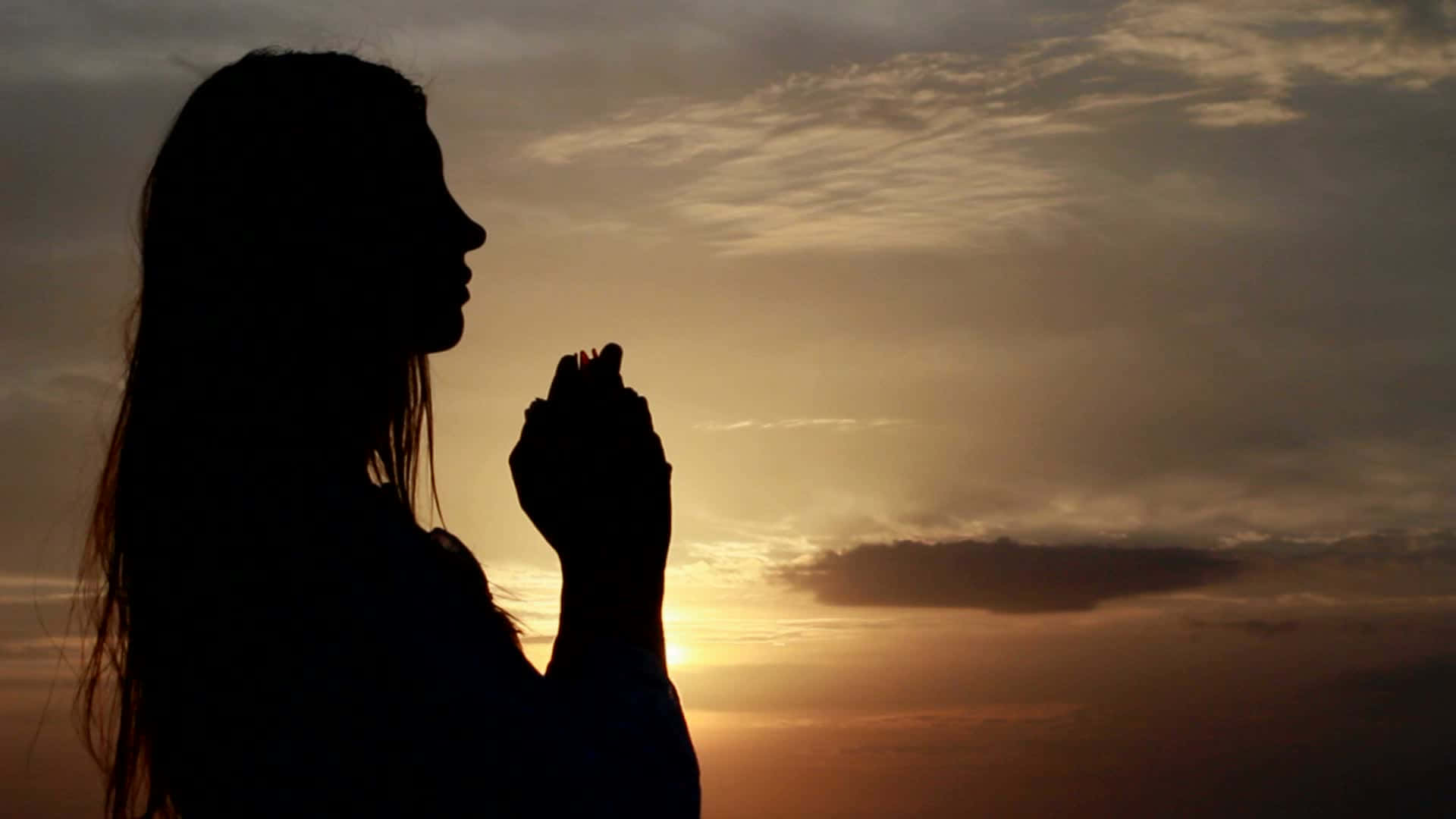 Woman Praying Silhouette At The Beach Wallpaper