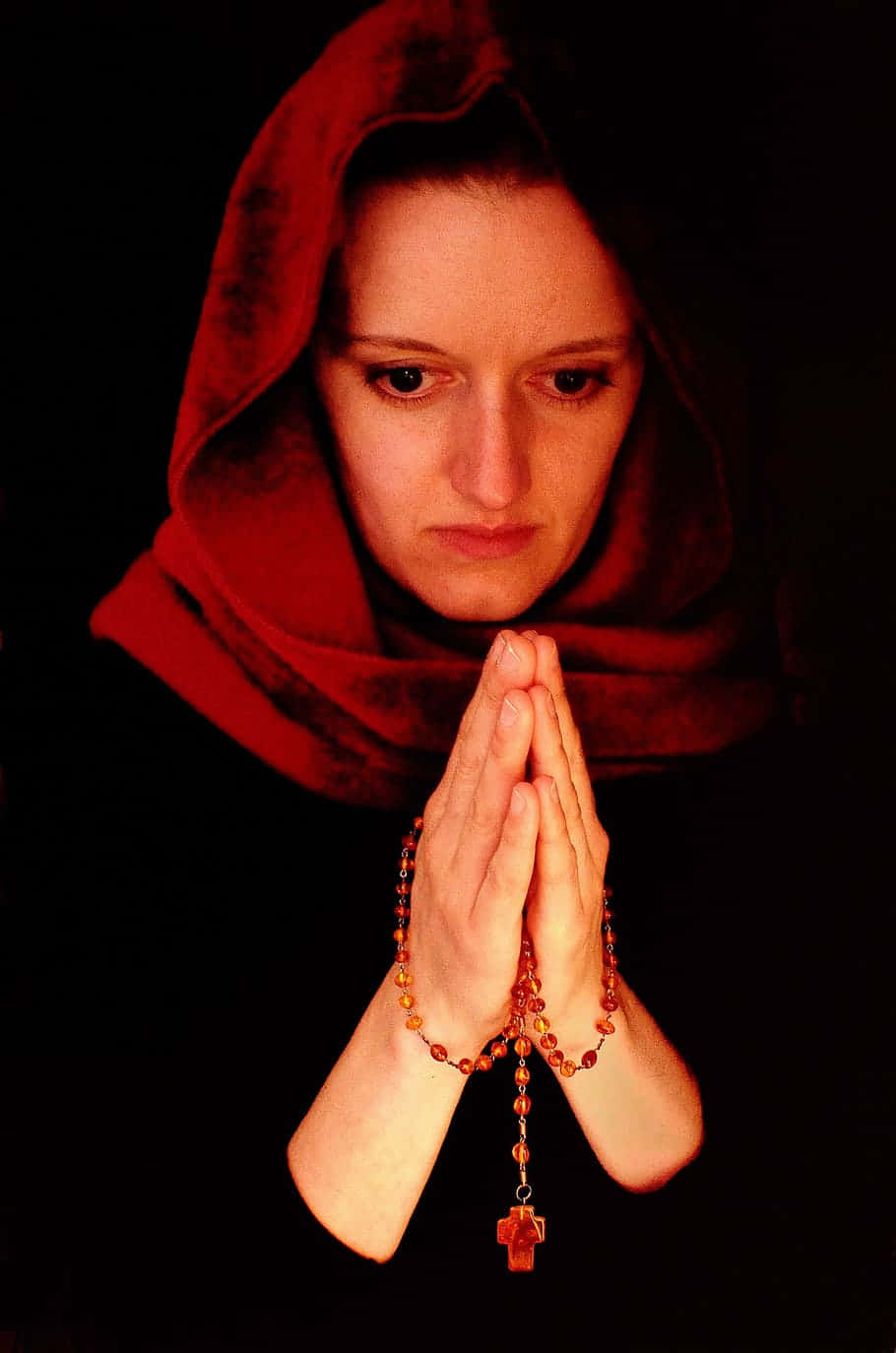 Woman Praying With A Red Scarf Wallpaper