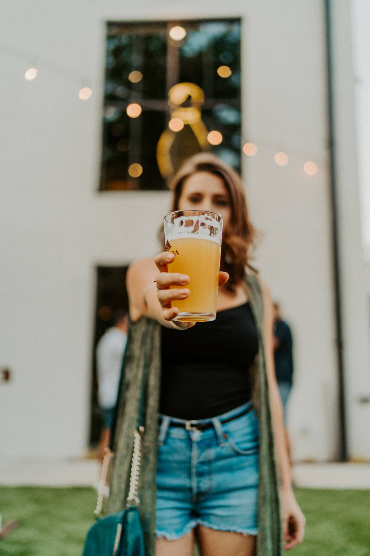 Woman Raising Beer