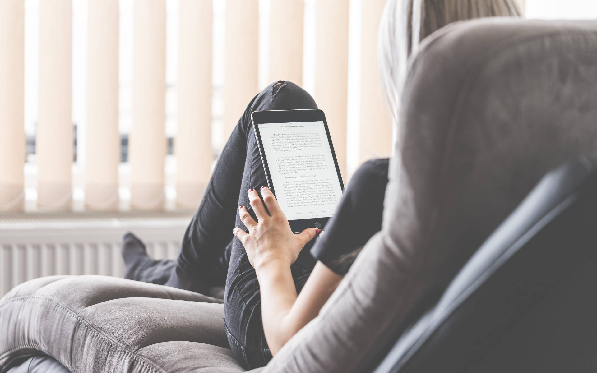 Woman Reading Ebook On Tablet Wallpaper