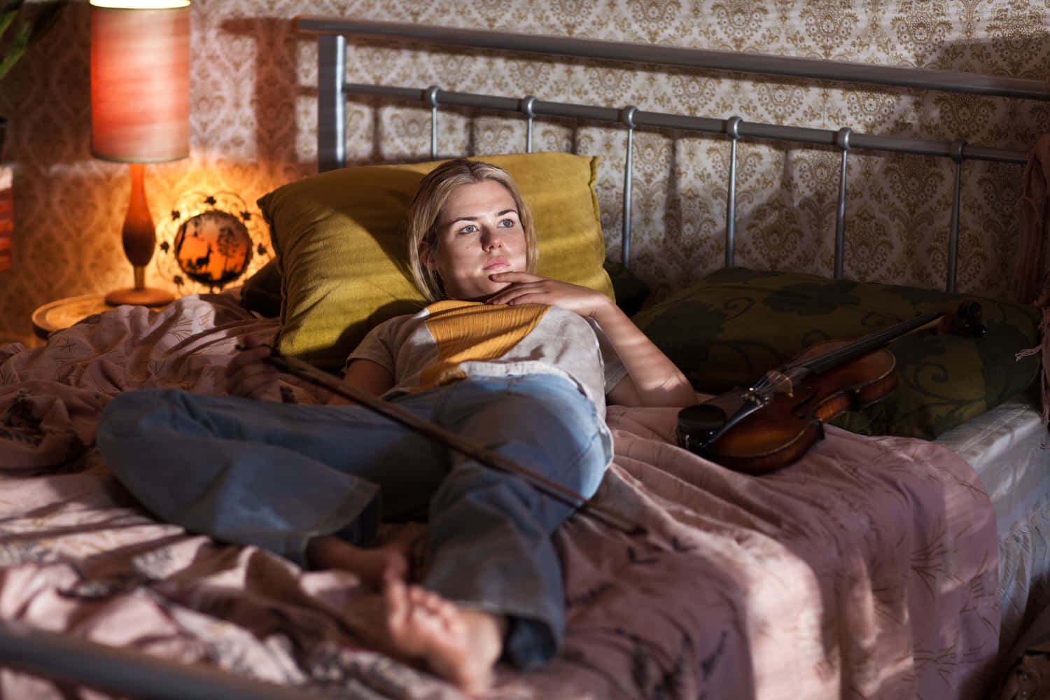 Woman Relaxingwith Violinin Bedroom Wallpaper