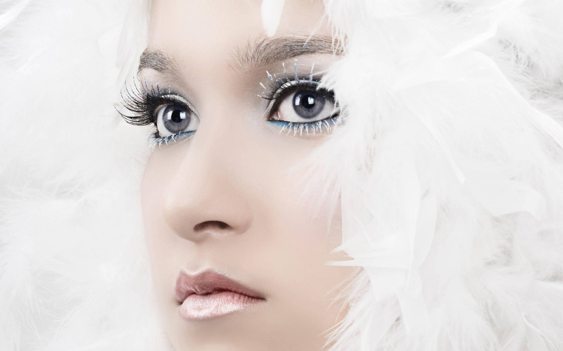 Woman's Face With White Feathers Wallpaper