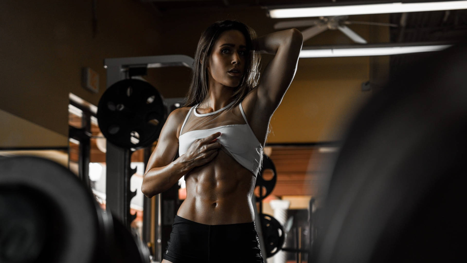 Woman Showing Gym Abs Wallpaper