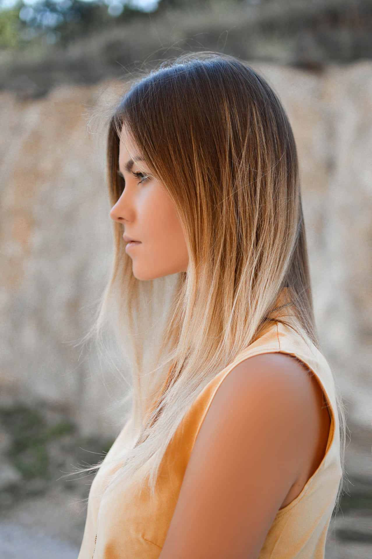 Enigmatic Beauty: Side Profile of a Woman with Ombre Hair Wallpaper