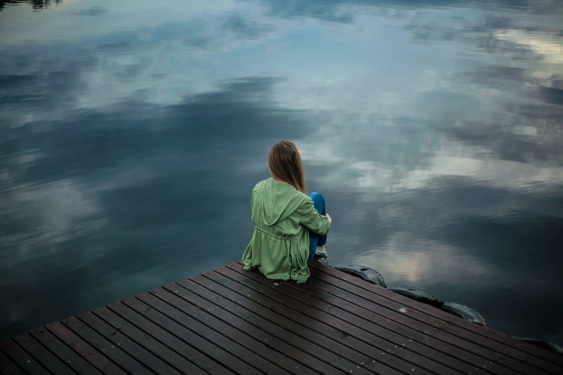 Woman Sitting Alone At Dock Background