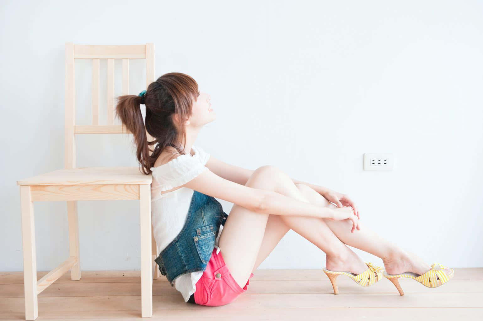 Woman Sitting Beside Chair Bare Legs Wallpaper