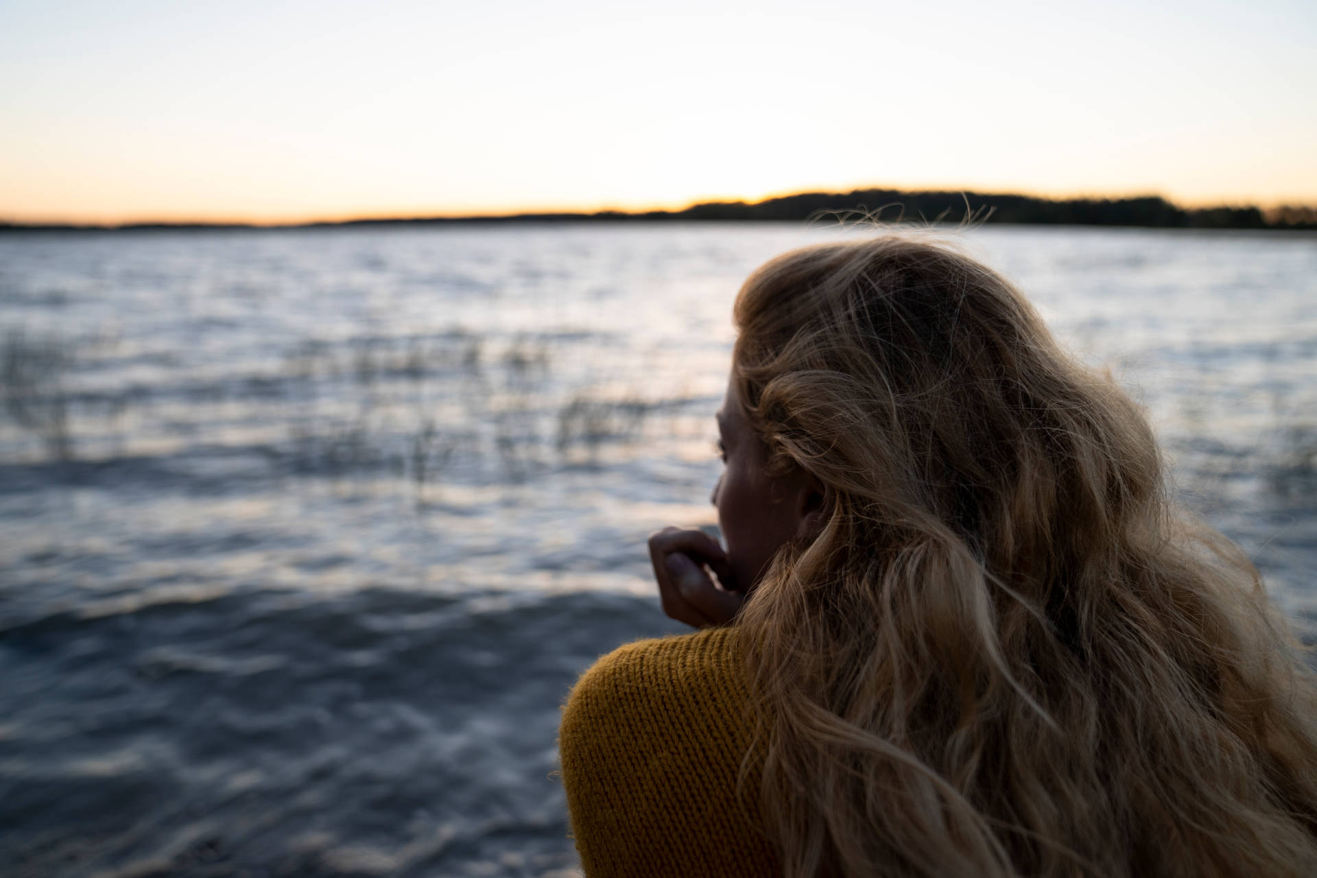 Woman Staring At Lake Finland