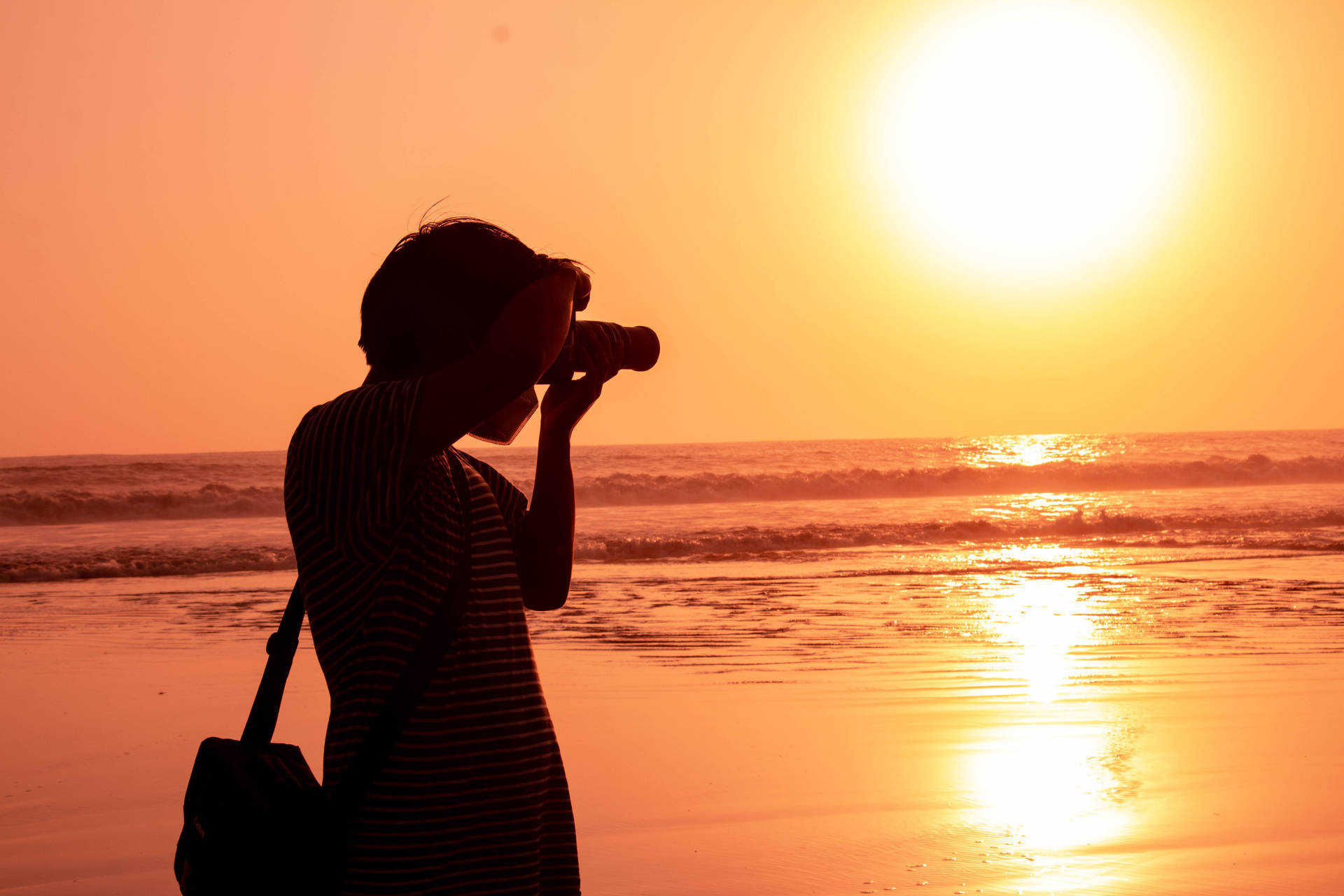 Woman Taking Photo Sunset Wallpaper