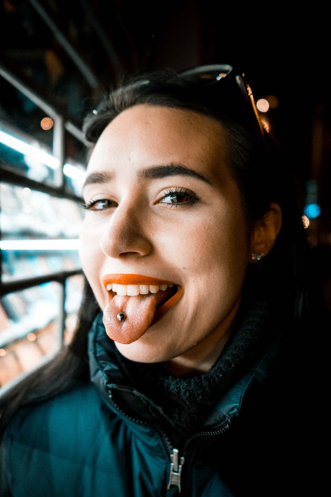 Woman showcasing tongue piercing Wallpaper
