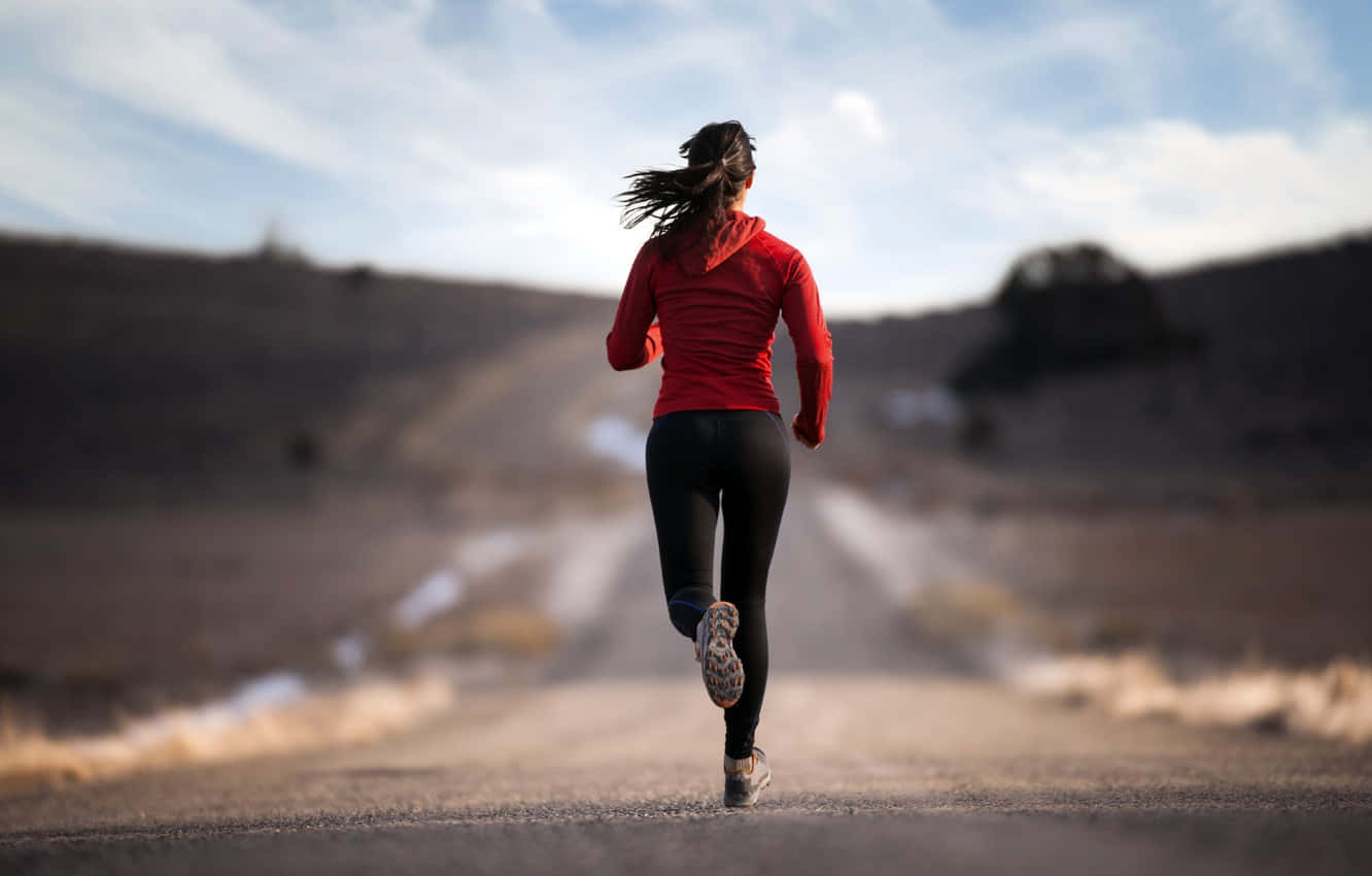 Woman Training For Marathon Wallpaper