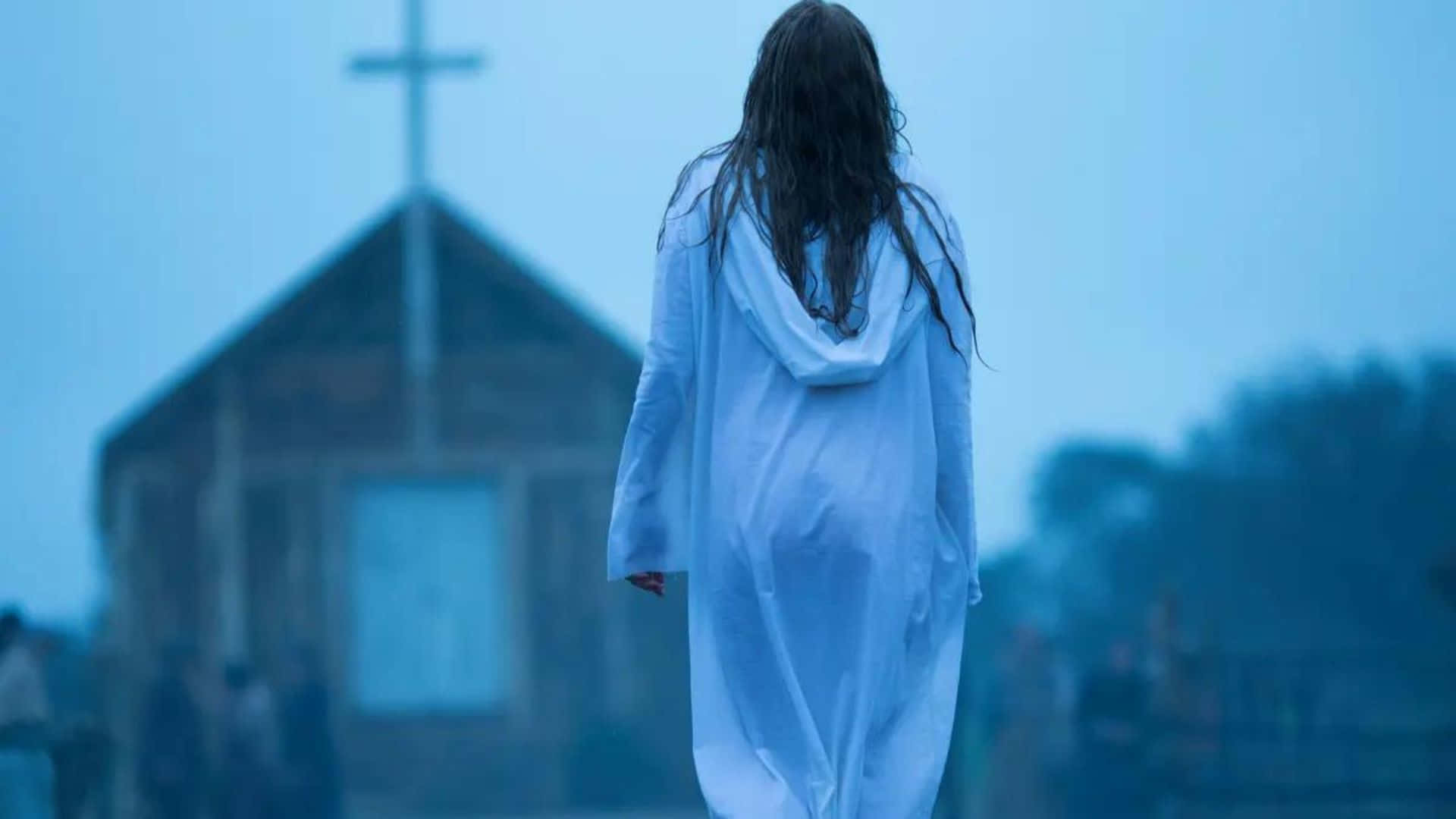 Woman Walking Towards Church Foggy Backdrop Wallpaper
