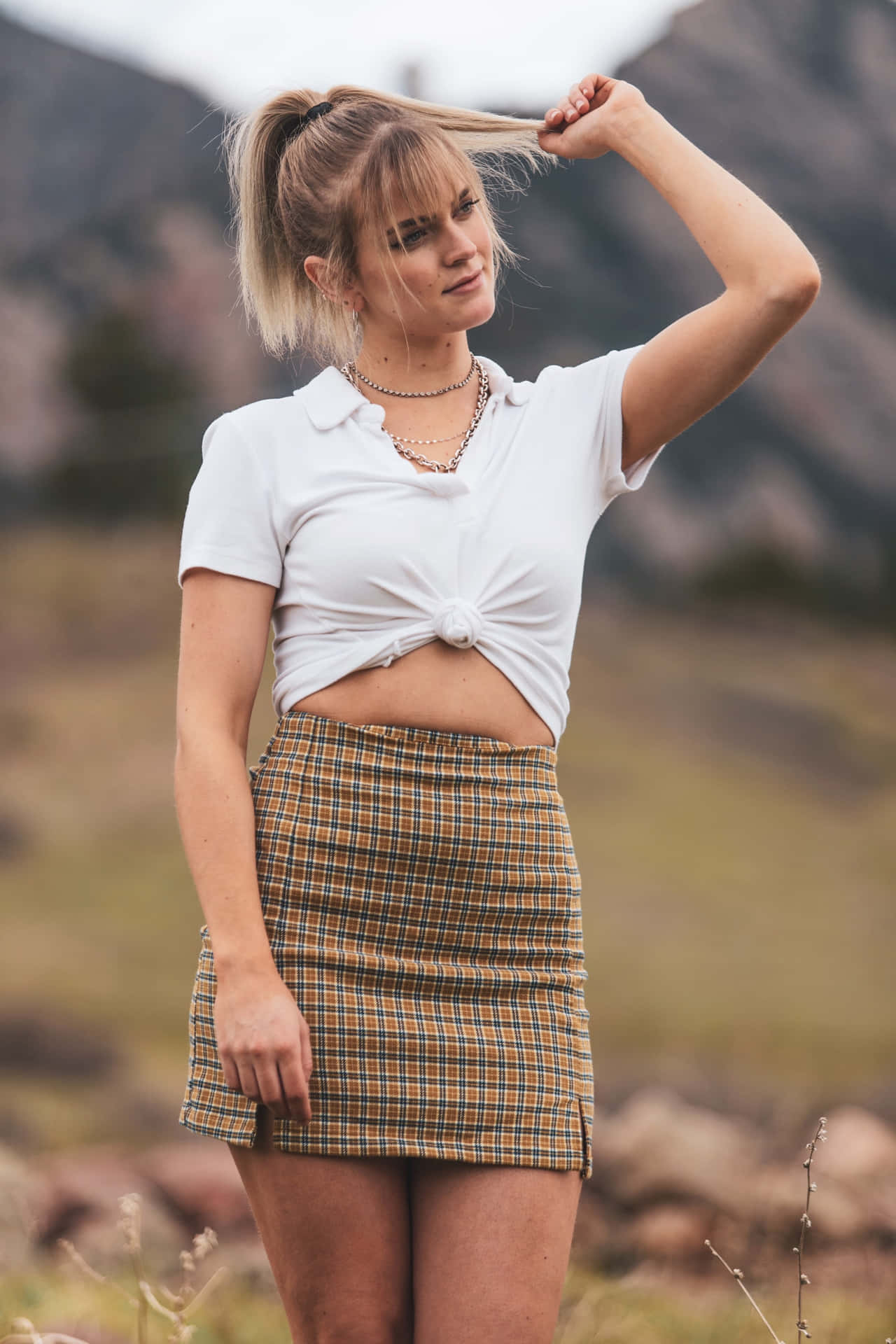 Woman Wearing Caramel Pleated Miniskirt Wallpaper