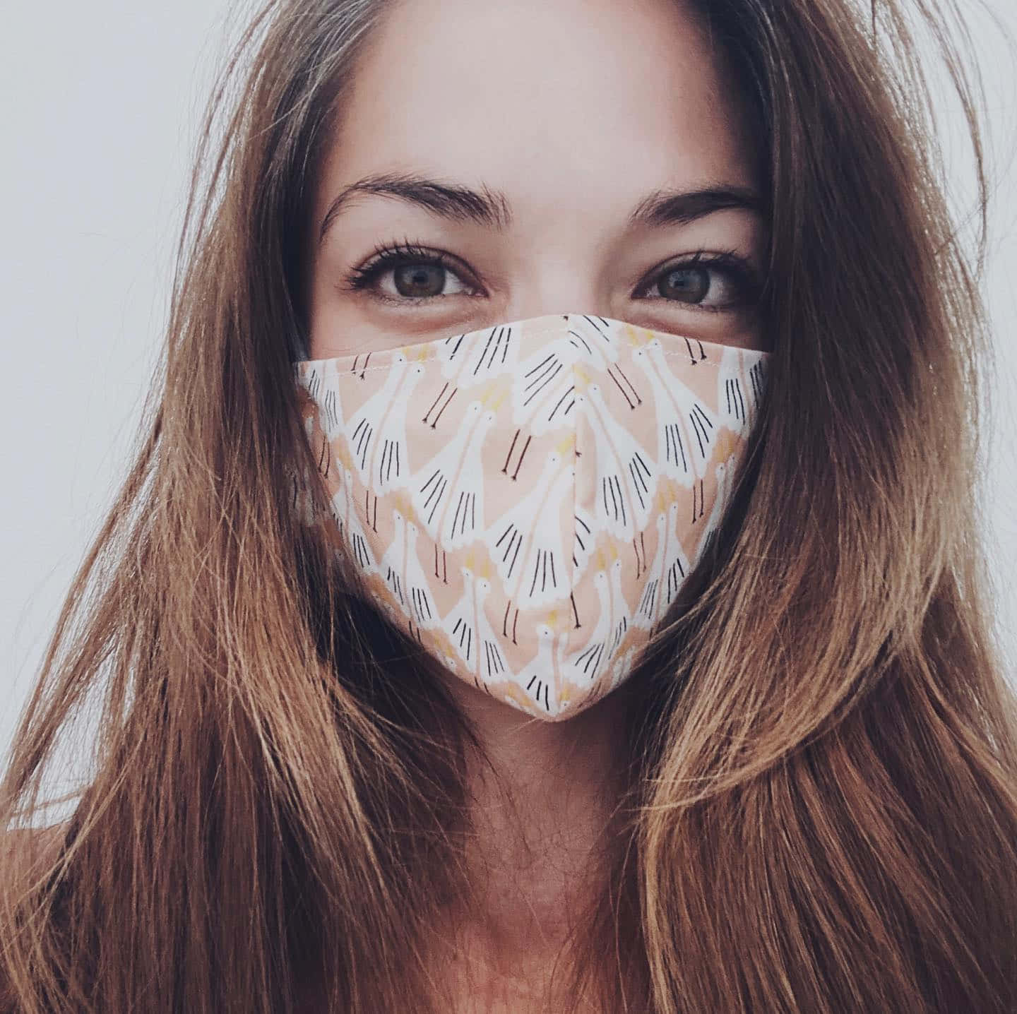 Woman Wearing Patterned Face Mask Wallpaper