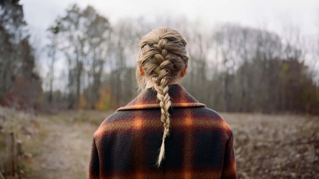 Woman_with_ Braided_ Hair_ Outdoors Wallpaper