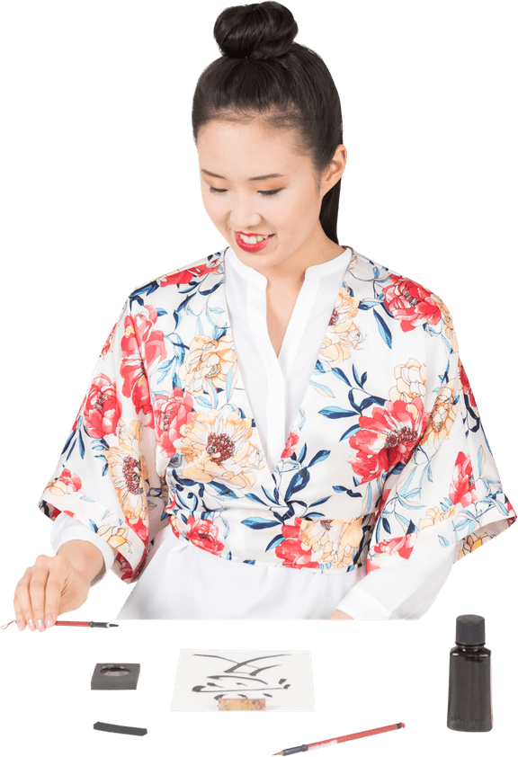 Womanin Floral Kimono Practicing Calligraphy PNG