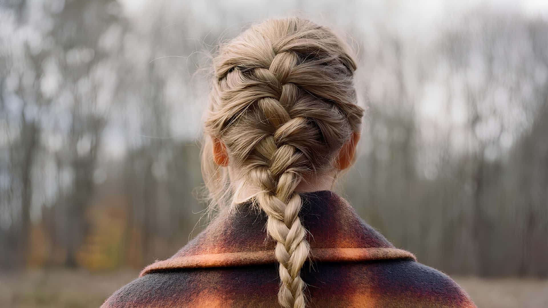 Womanwith Braided Hair Outdoors Wallpaper