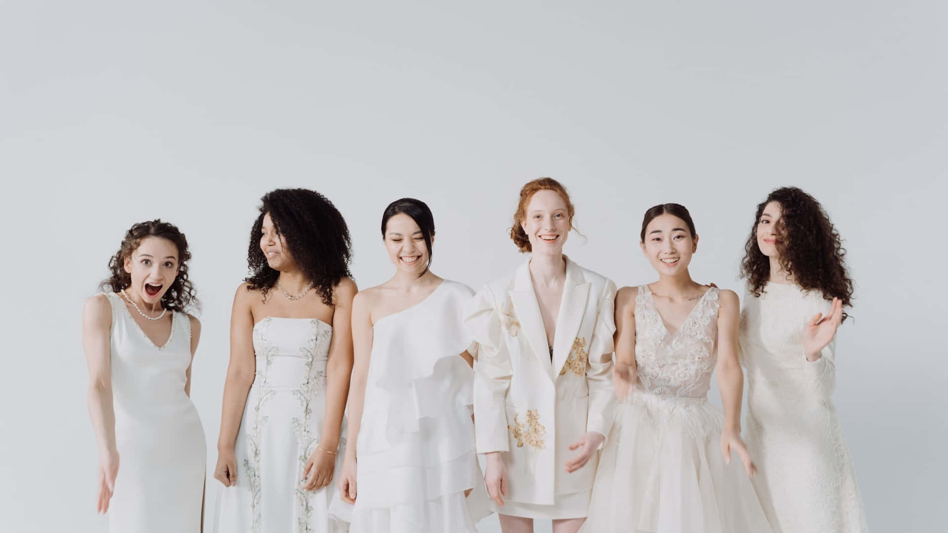 A Group Of Women In White Wedding Dresses