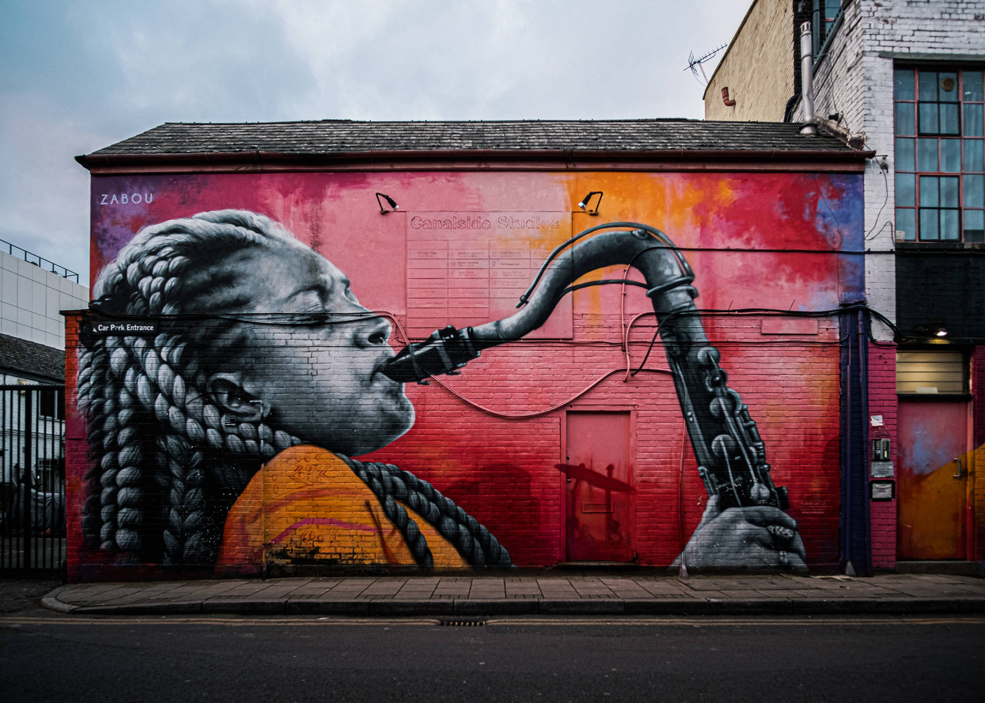 Women Playing Saxophone Street Art Wallpaper