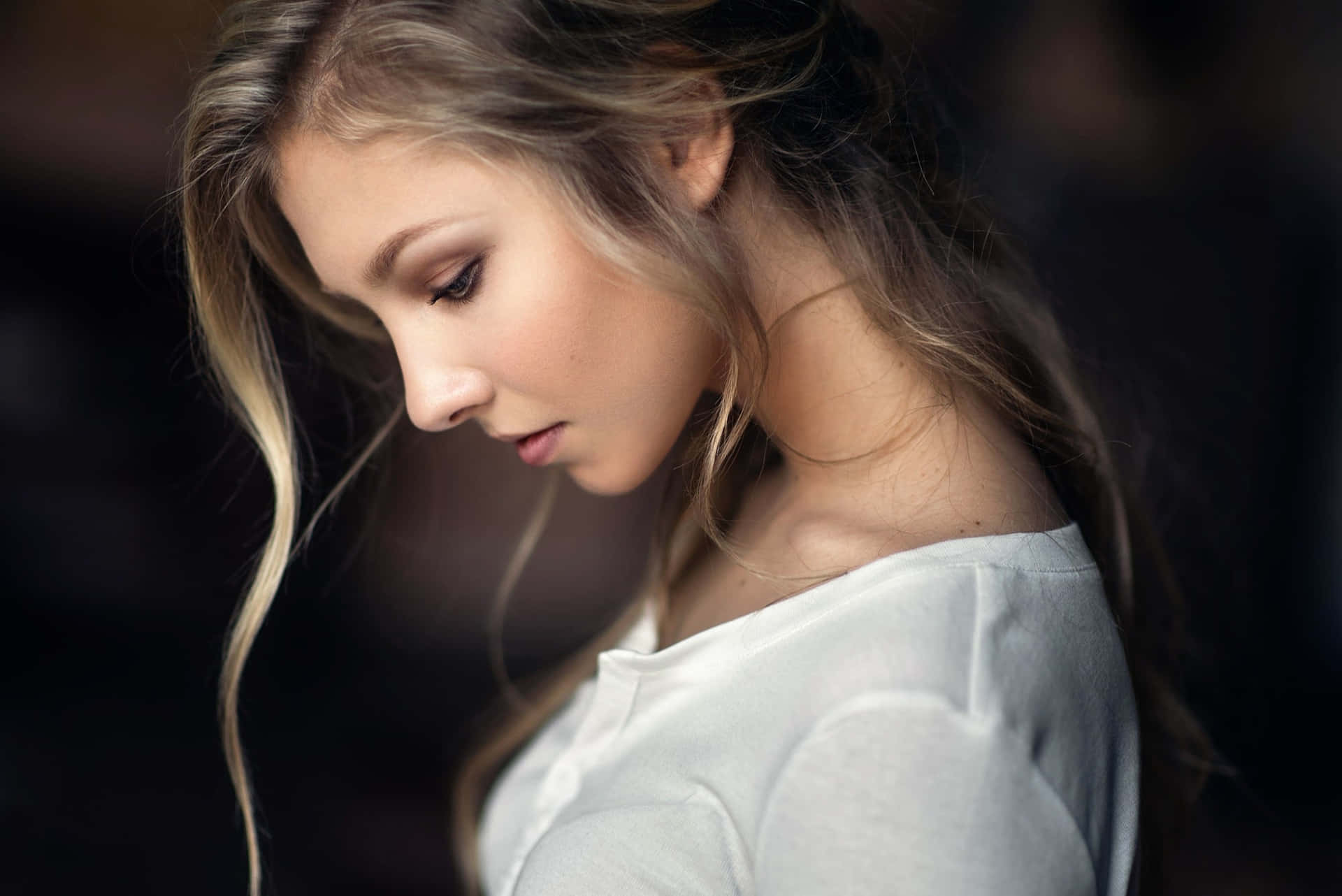 A Young Woman With Long Hair Looking Away