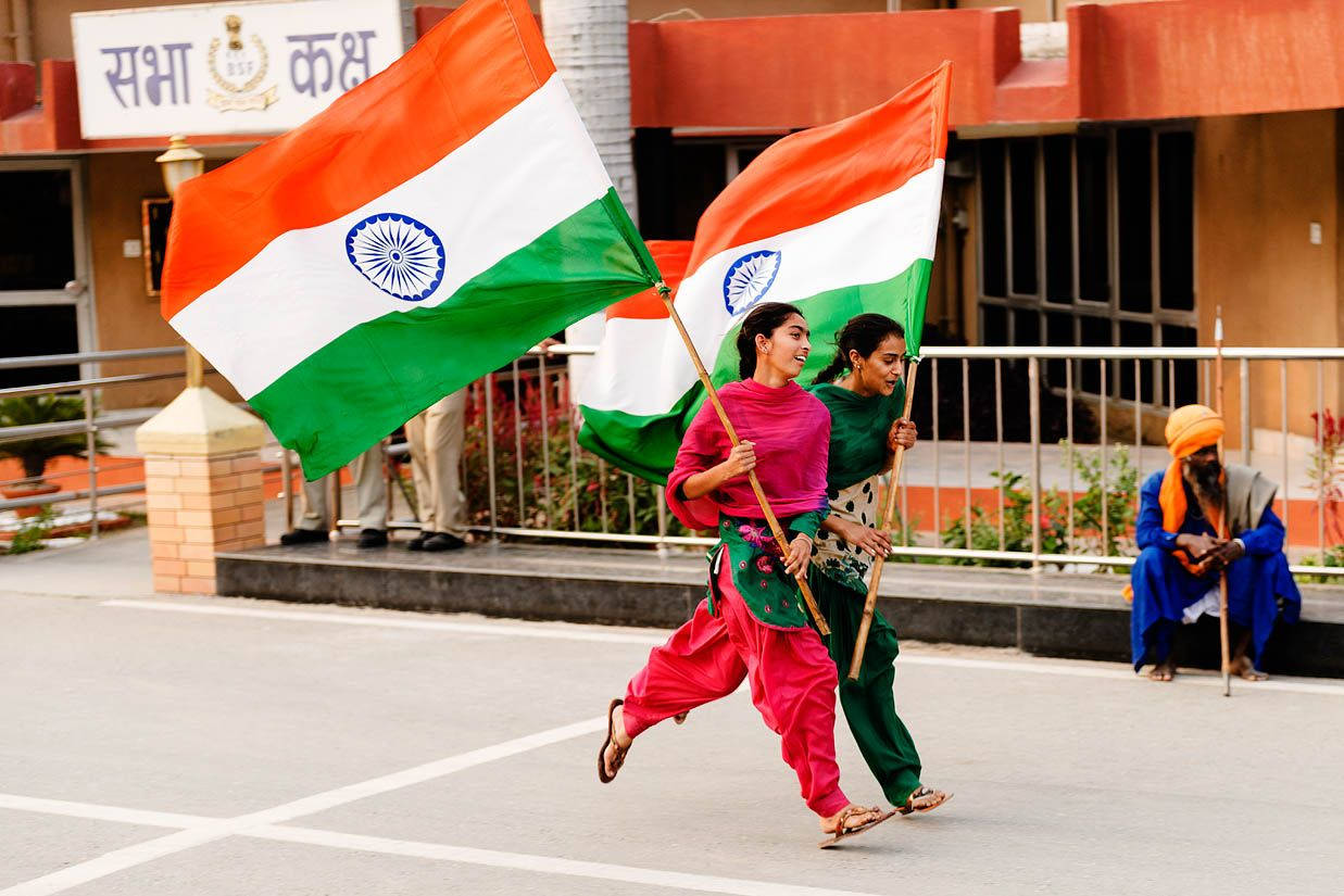 Women Running With The Indian Flag Background
