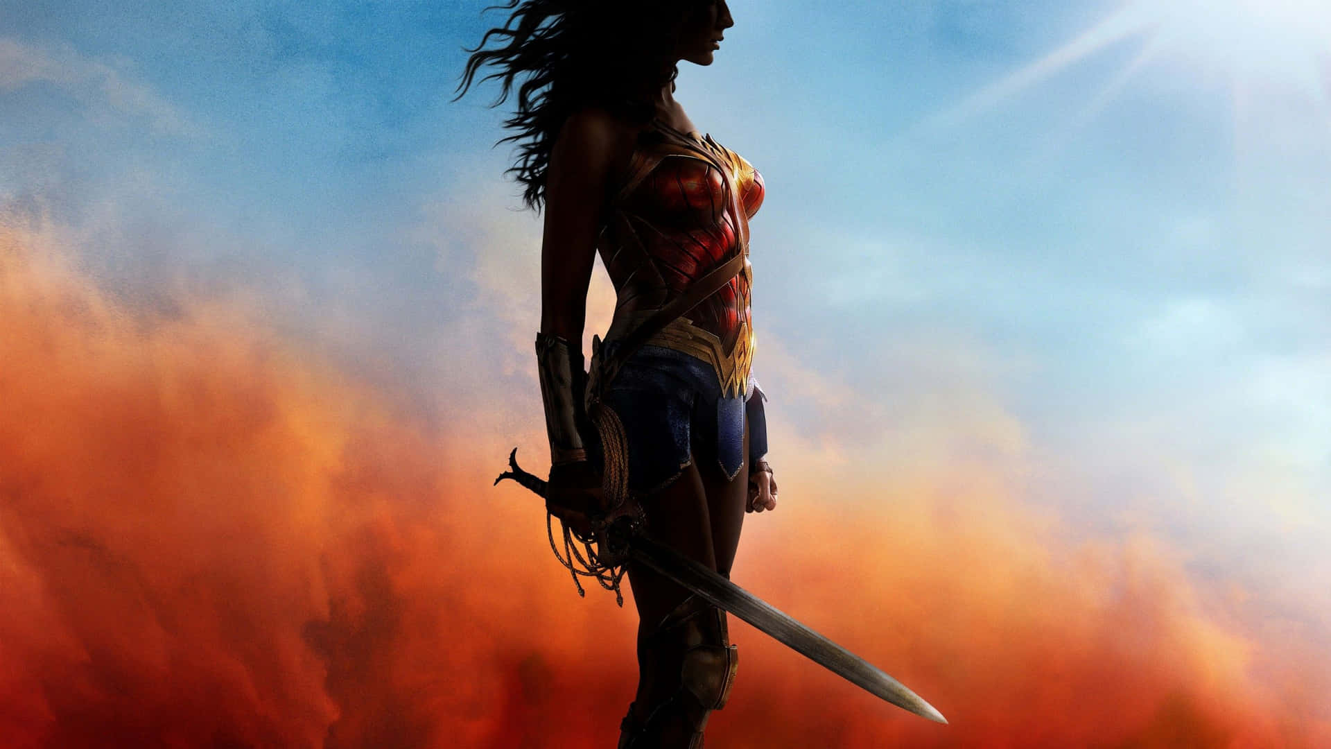 Wonder Woman standing strong surrounded by fires