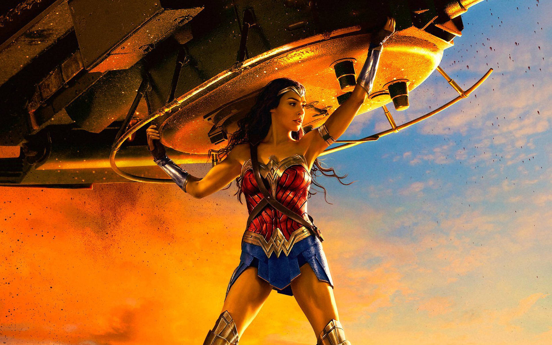 Wonder Woman powerfully lifting a tank. Wallpaper