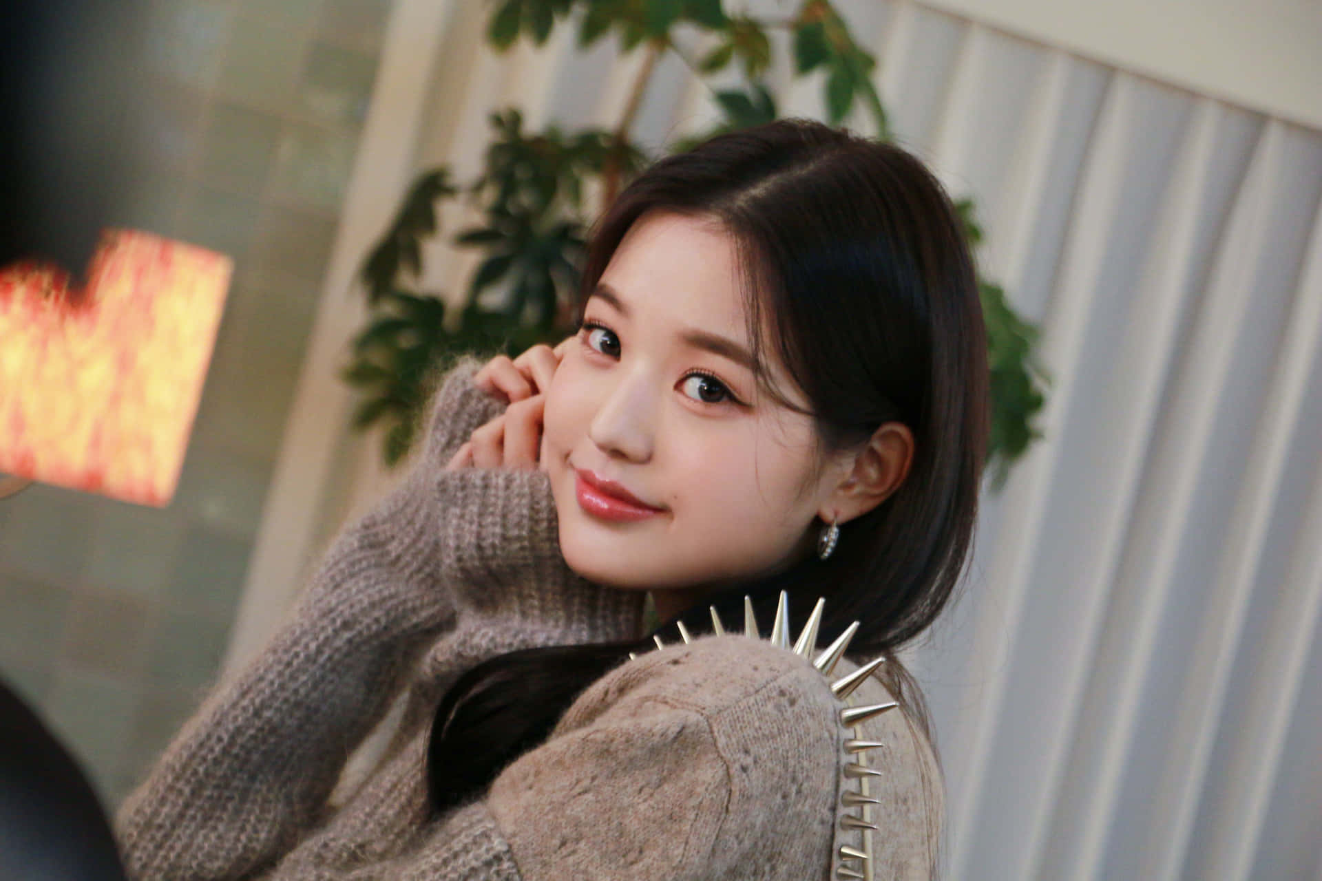 Wonyoung Adorning a Miu Miu Knit Sweater Wallpaper