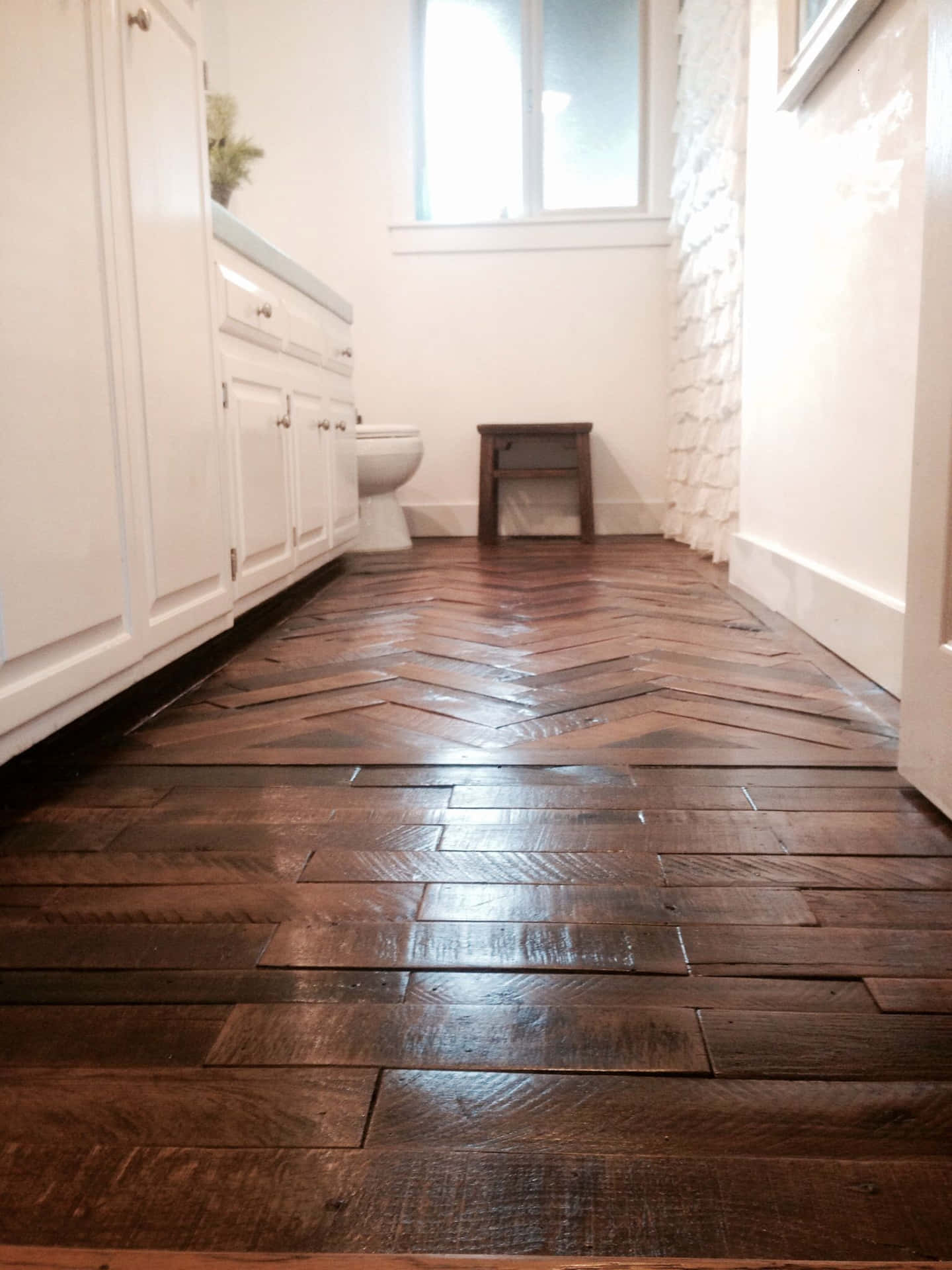 A Bathroom With A Wooden Floor