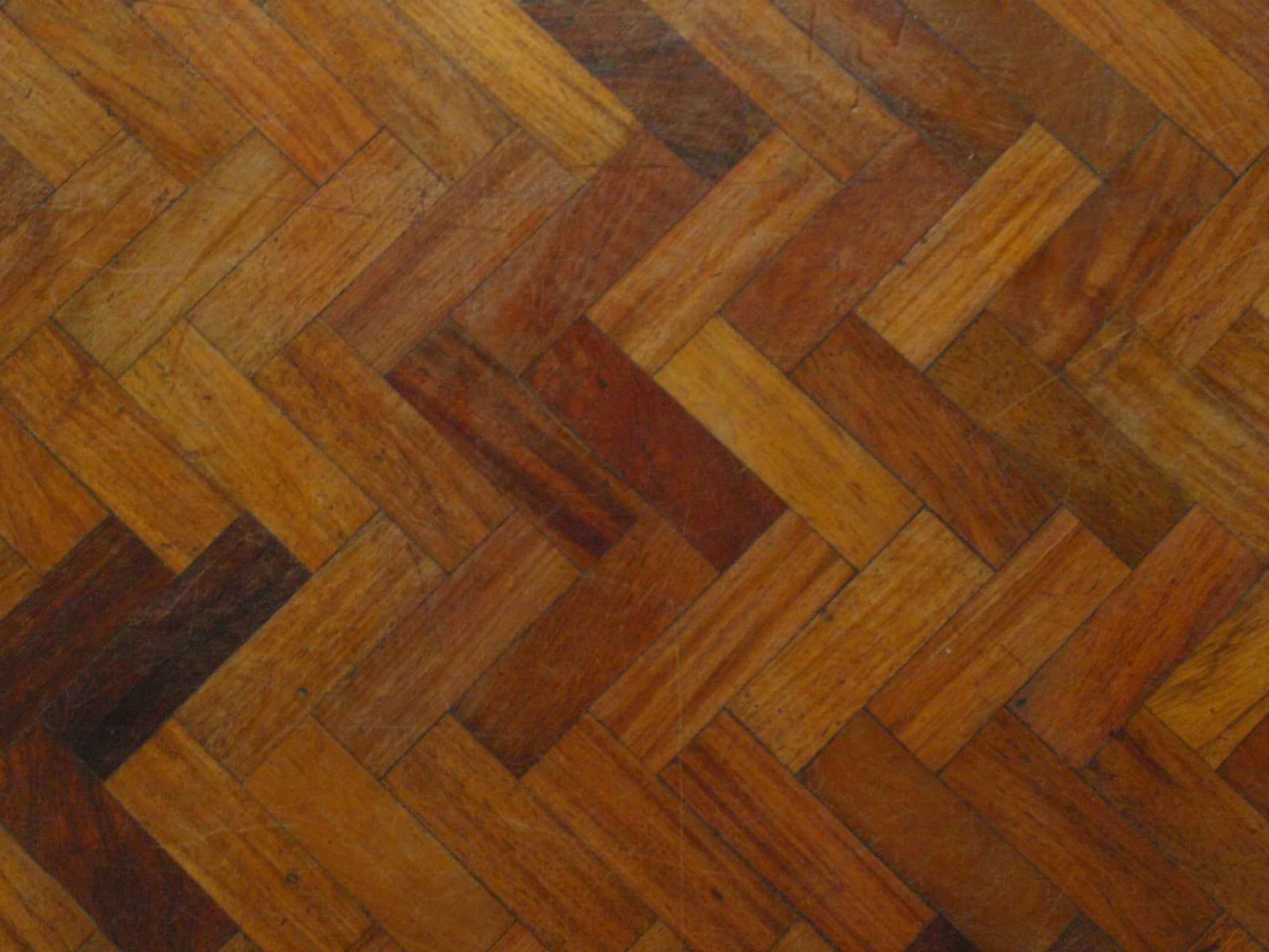 A Close Up Of A Wooden Floor With A Pattern