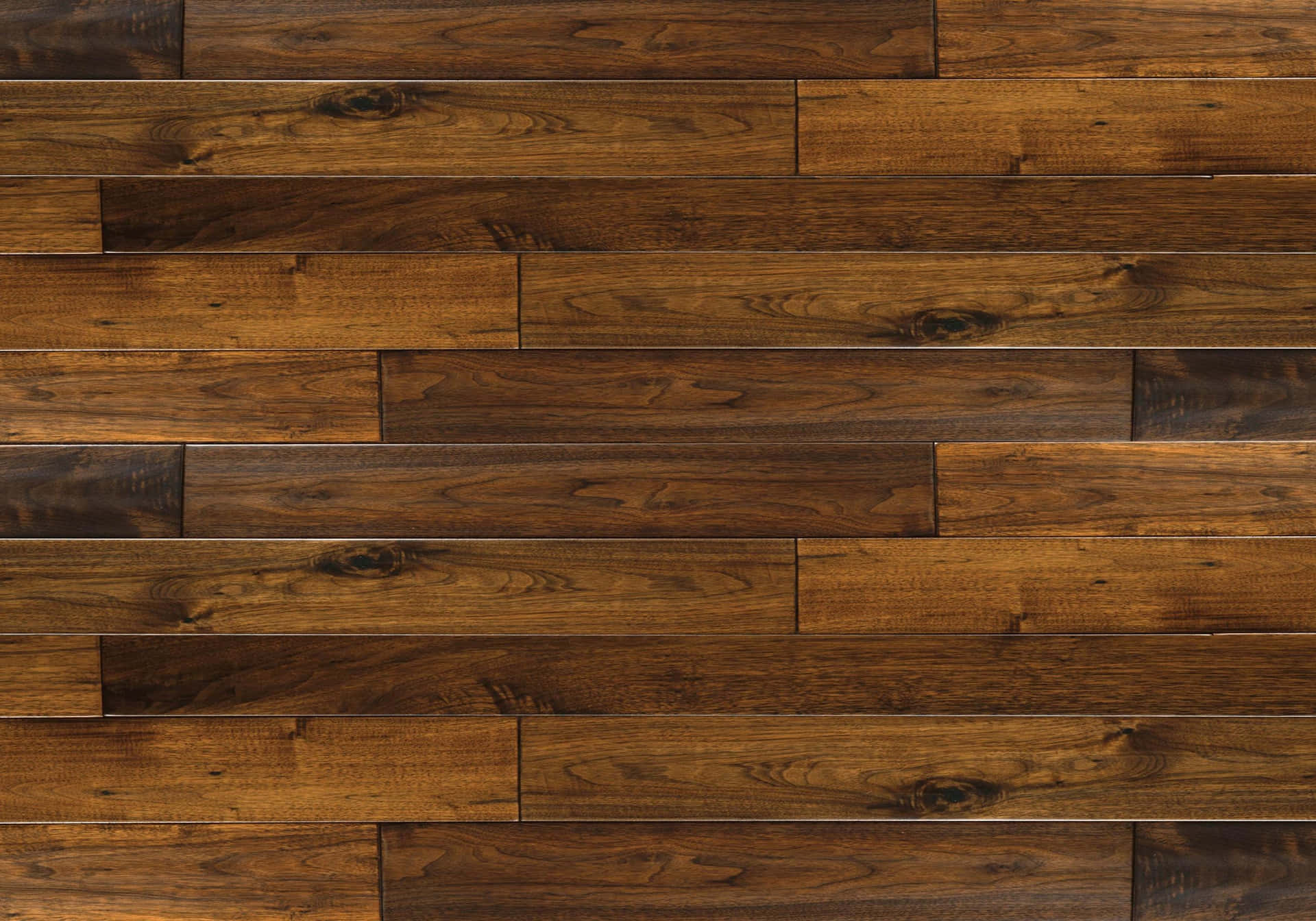 A Close Up Of A Wooden Floor With Dark Brown Wood