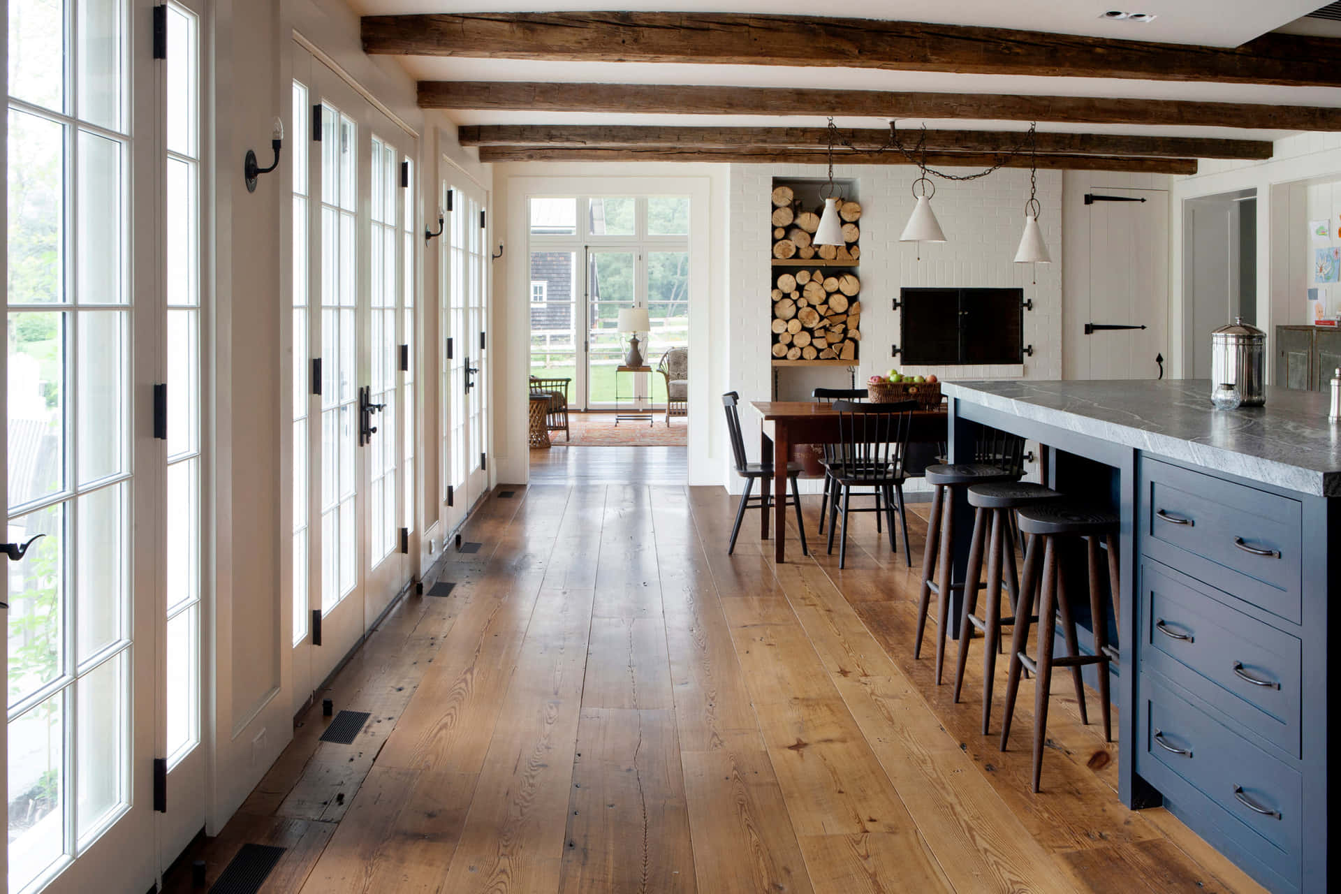 A Kitchen With Wood Floors And A Bar