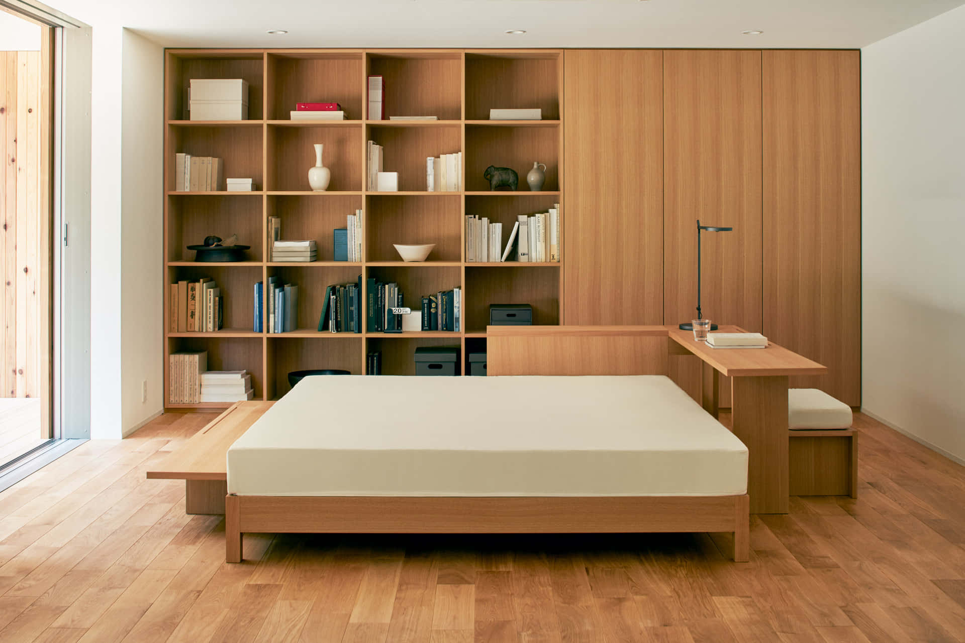 A Bed In A Room With A Bookcase