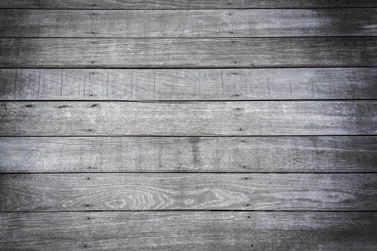 A Gray Wood Plank Background With A Black Background