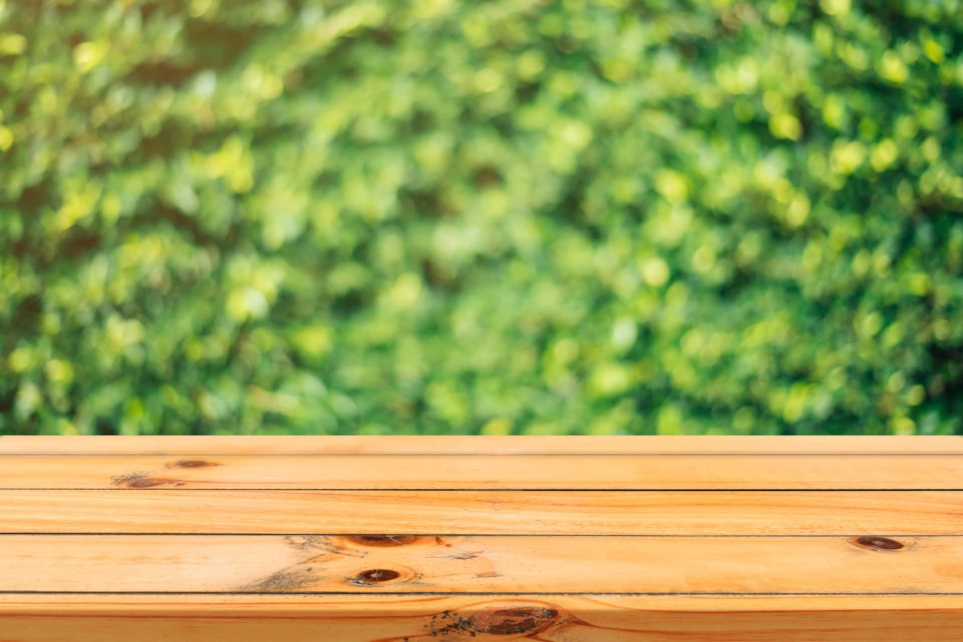 Wooden Table On A Green Background