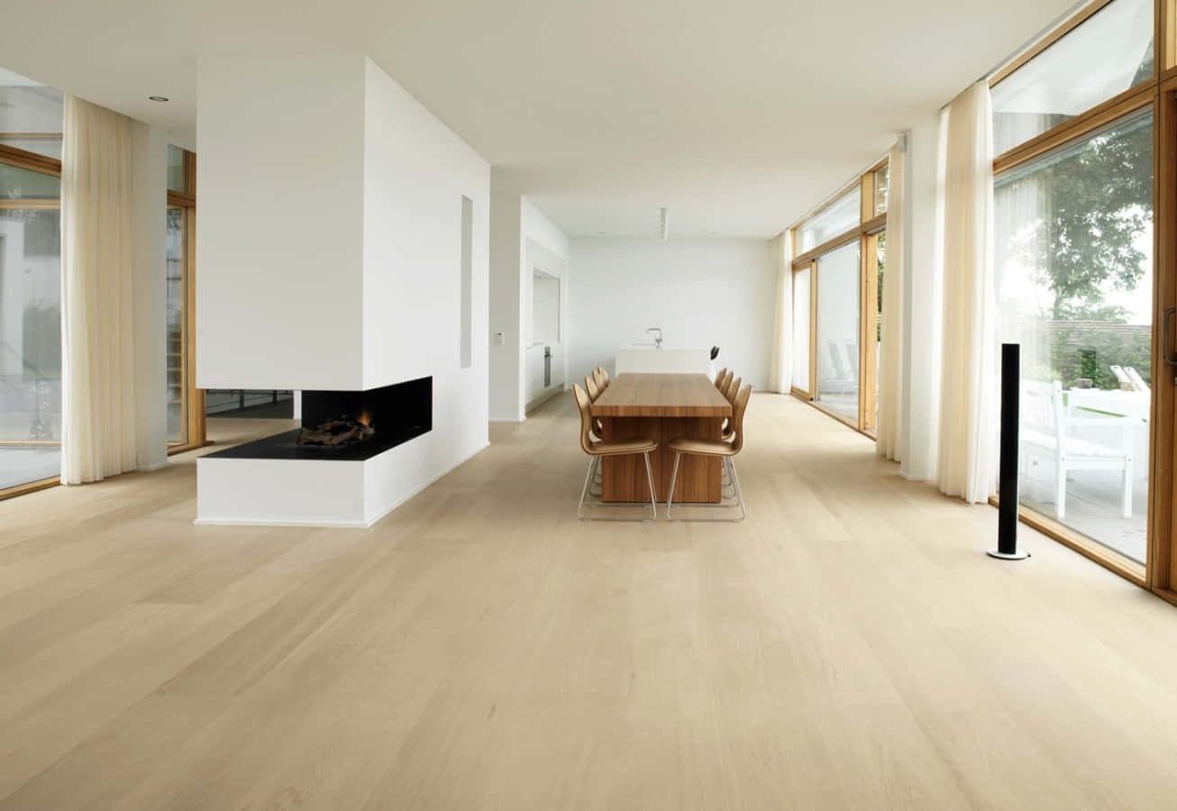 A Room With White Walls And Wooden Floors