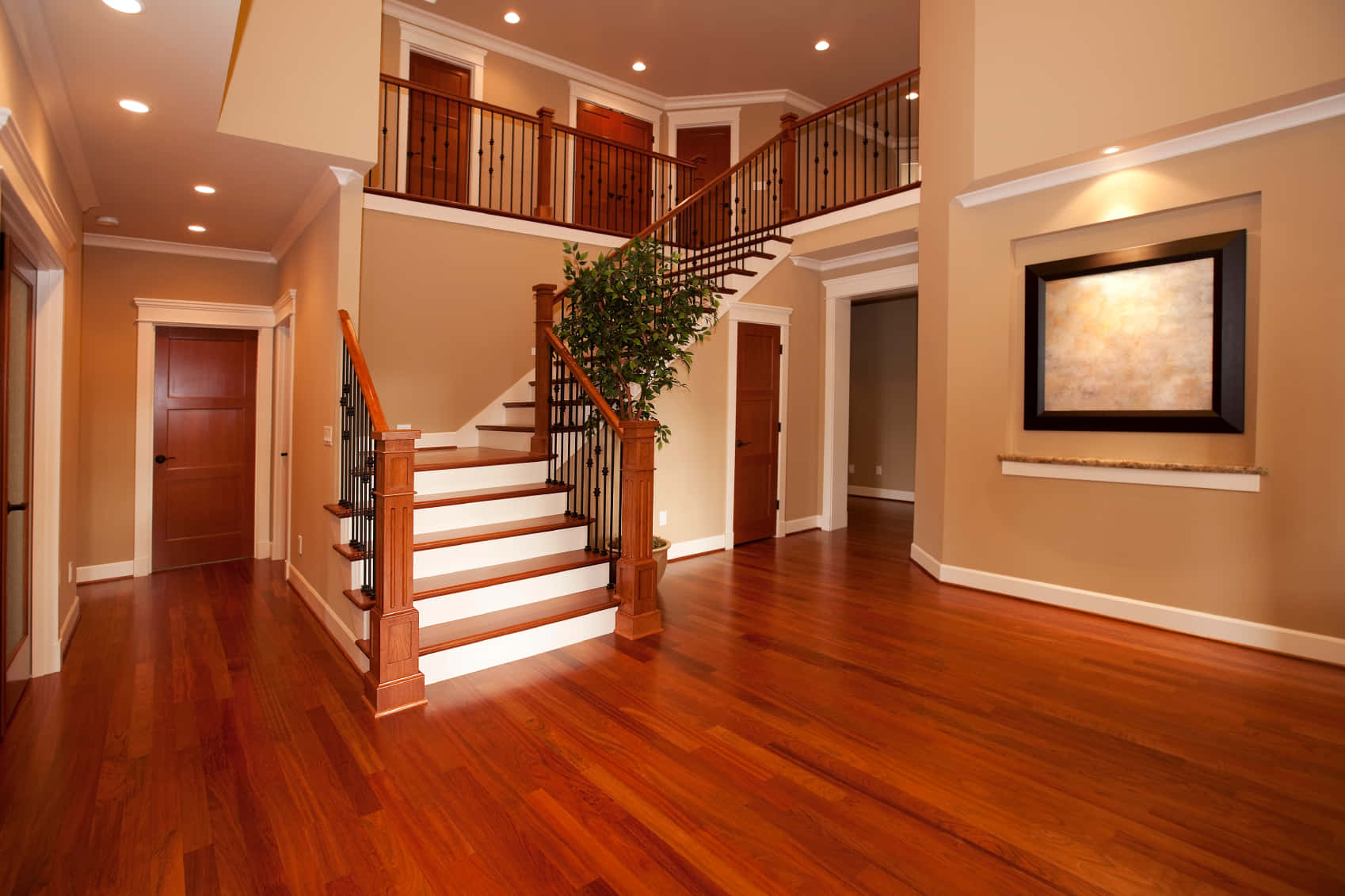 A Home With Hardwood Floors And Stairs