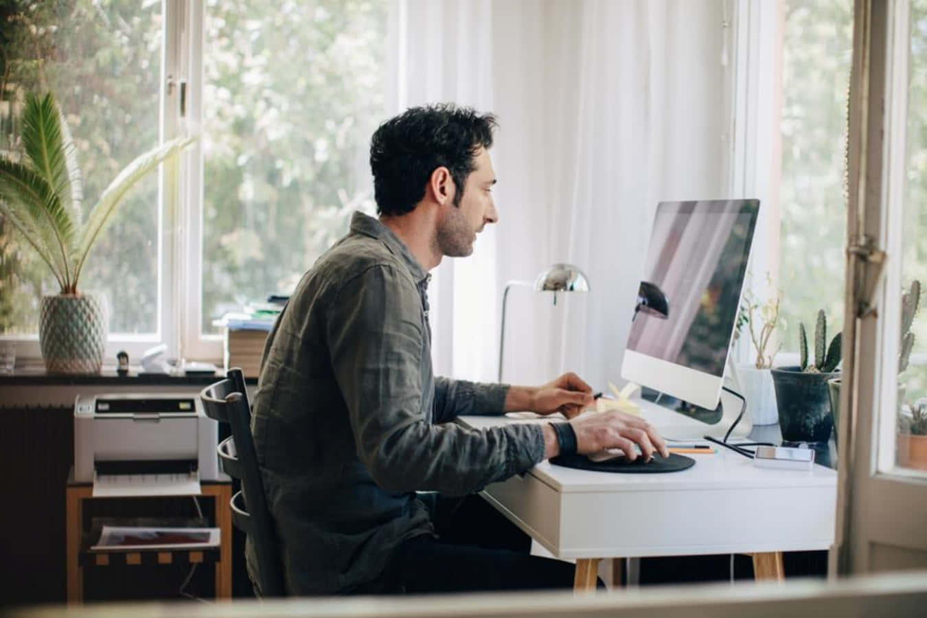 Man Working At Home On Computer