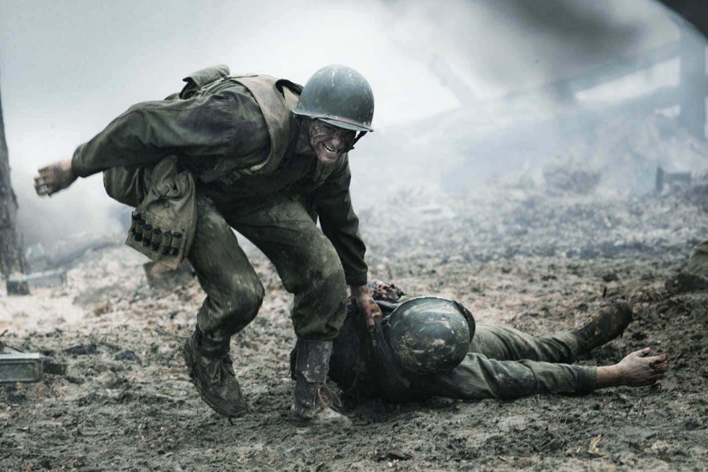 A Soldier Is Laying On The Ground With A Helmet