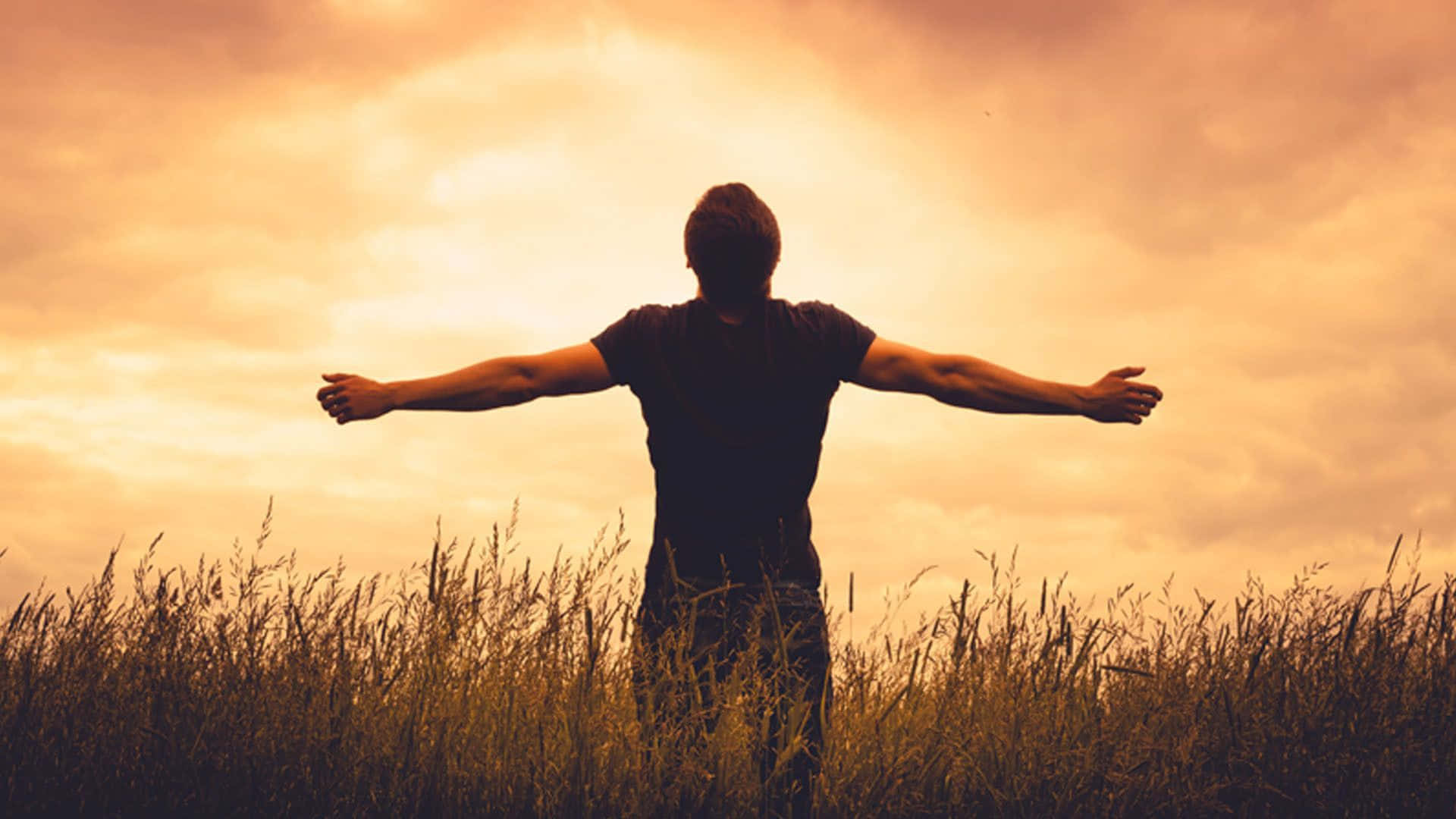 Man Standing On A Field Worship Background